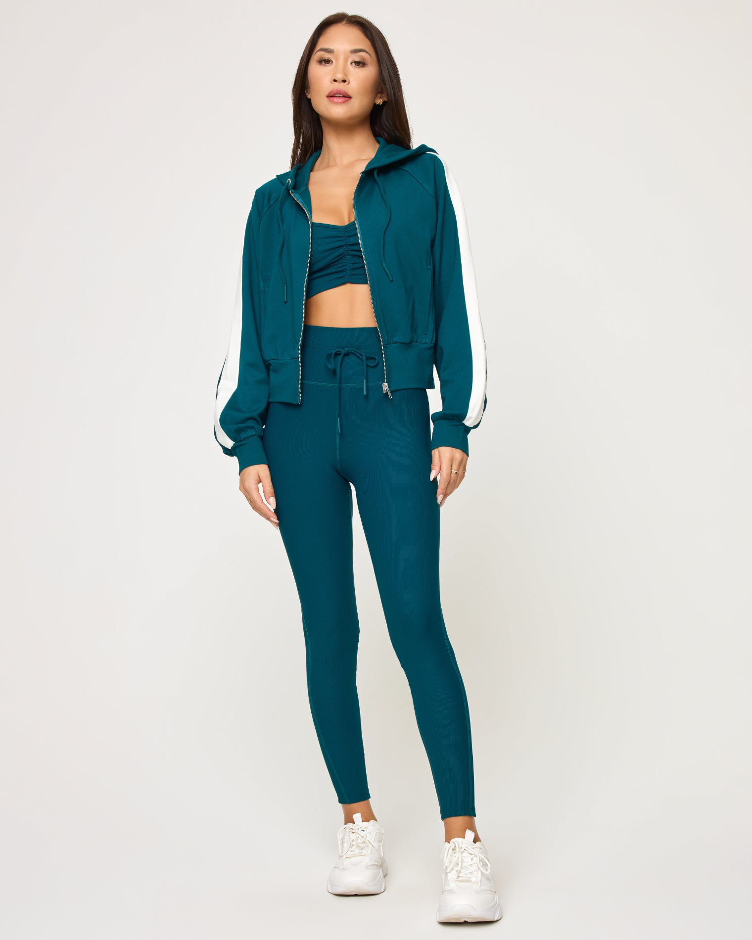 Back To Back Jacket - Deep Teal-Cream Front view of model wearing the Back To Back Jacket in deep teal-cream with matching deep teal-cream Back To Back Pant and white sneakers.