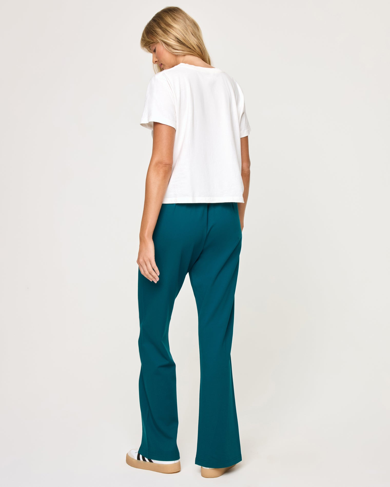 Back To Back Pant - Deep Teal-Cream Back view of model wearing the Back To Back Pant in deep teal-cream showing the cream contrast side stripe and wide-leg cut, with matching Back To Back Jacket.