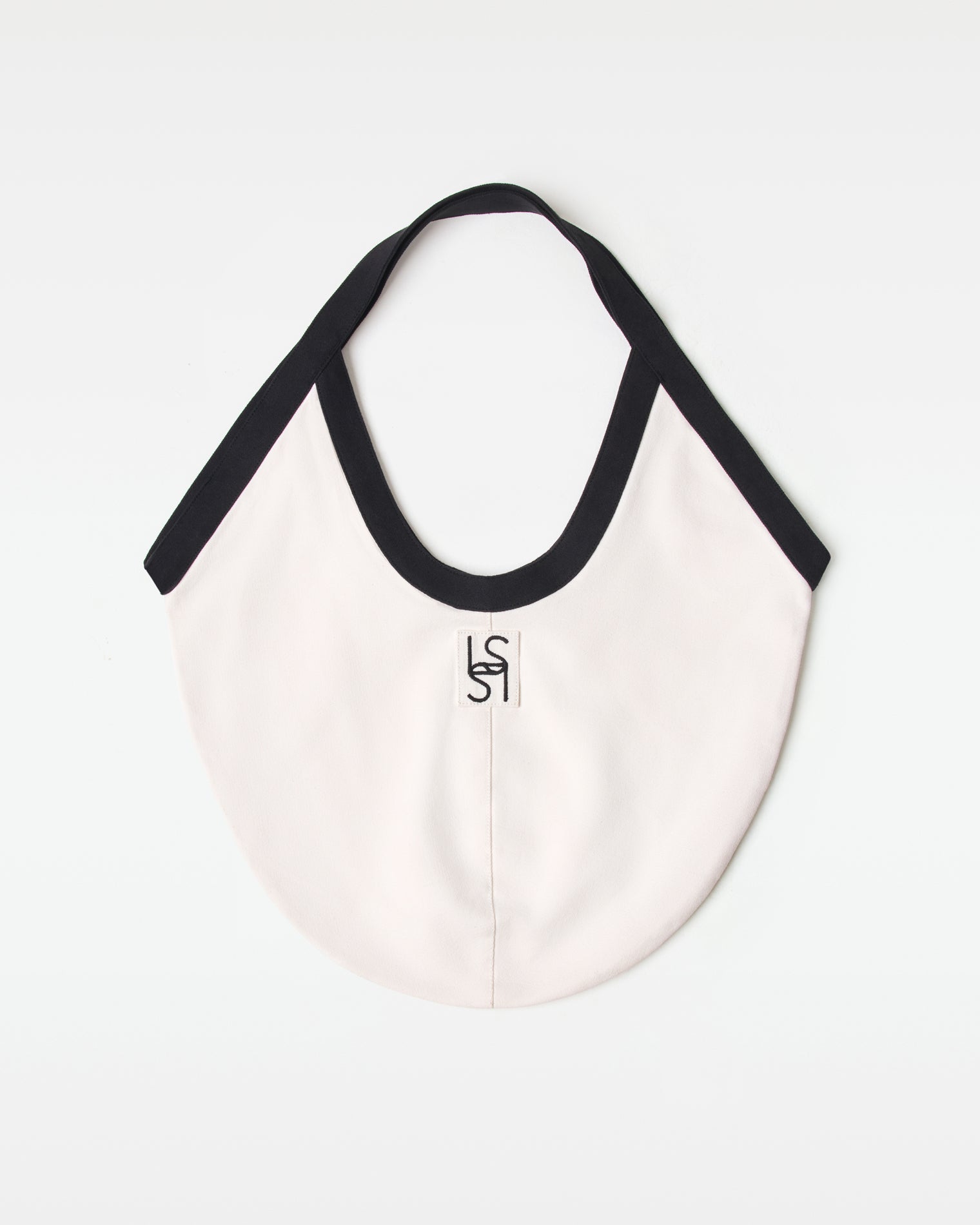 Bronte Canvas Bag - Black-Cream Off-model back view of the black and cream Bronte Canvas Bag showing a L*SPACE logo.