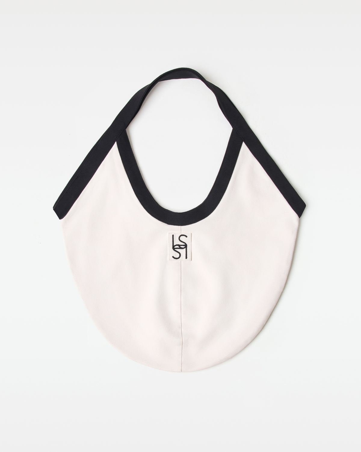 Bronte Canvas Bag - Black-Cream Off-model back view of the black and cream Bronte Canvas Bag showing a L*SPACE logo.