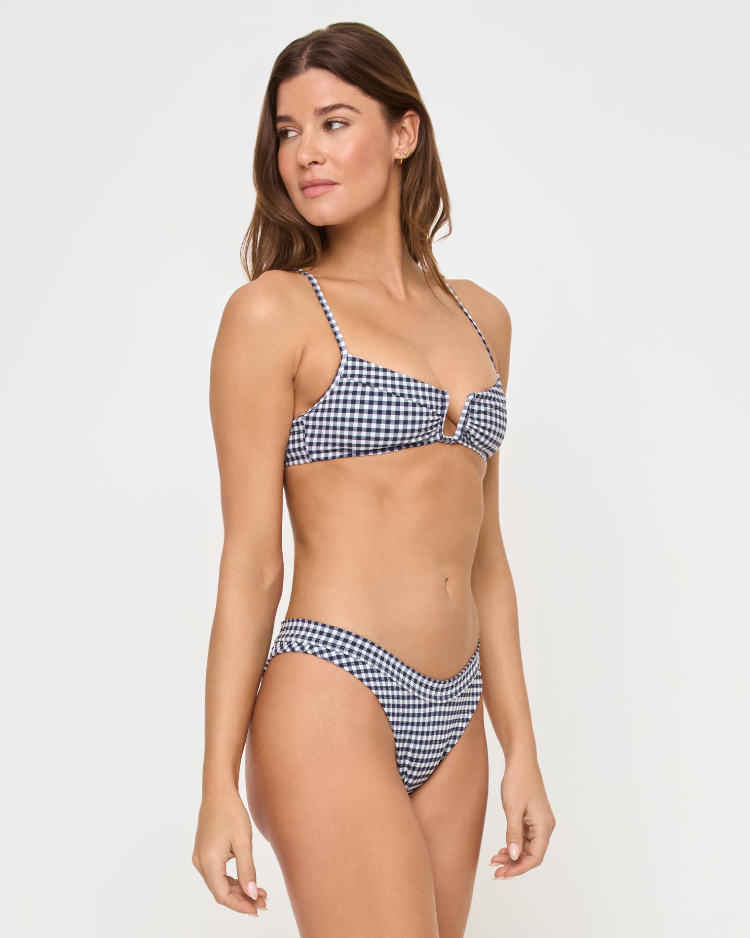 Peyton Bikini Top - Atta Girl Gingham side view of woman wearing blue and white gingham bikini in front of a white background