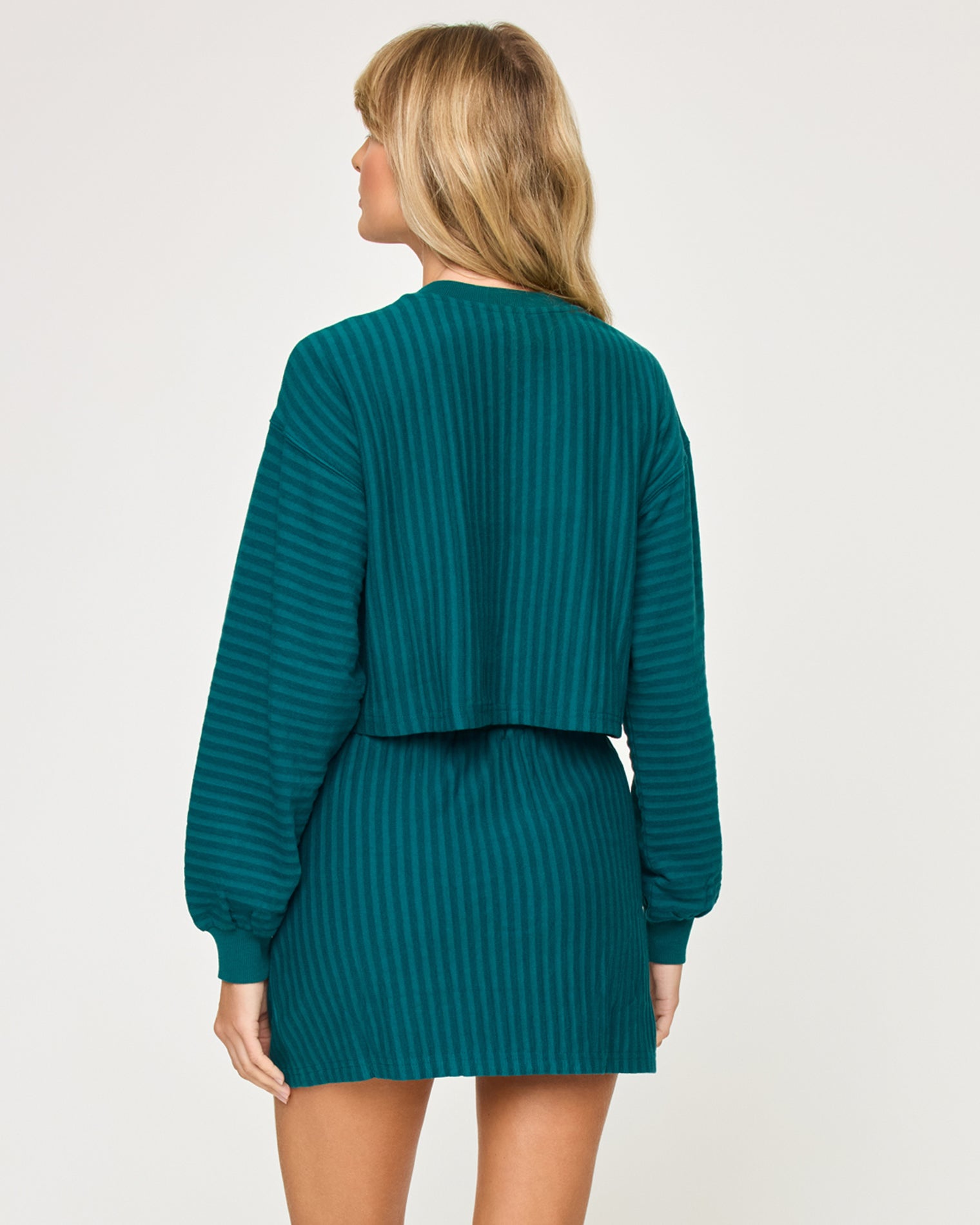 Half Court Pullover - Deep Teal Back view of model wearing the Half Court Pullover in deep teal with matching deep teal Half Court Skirt.