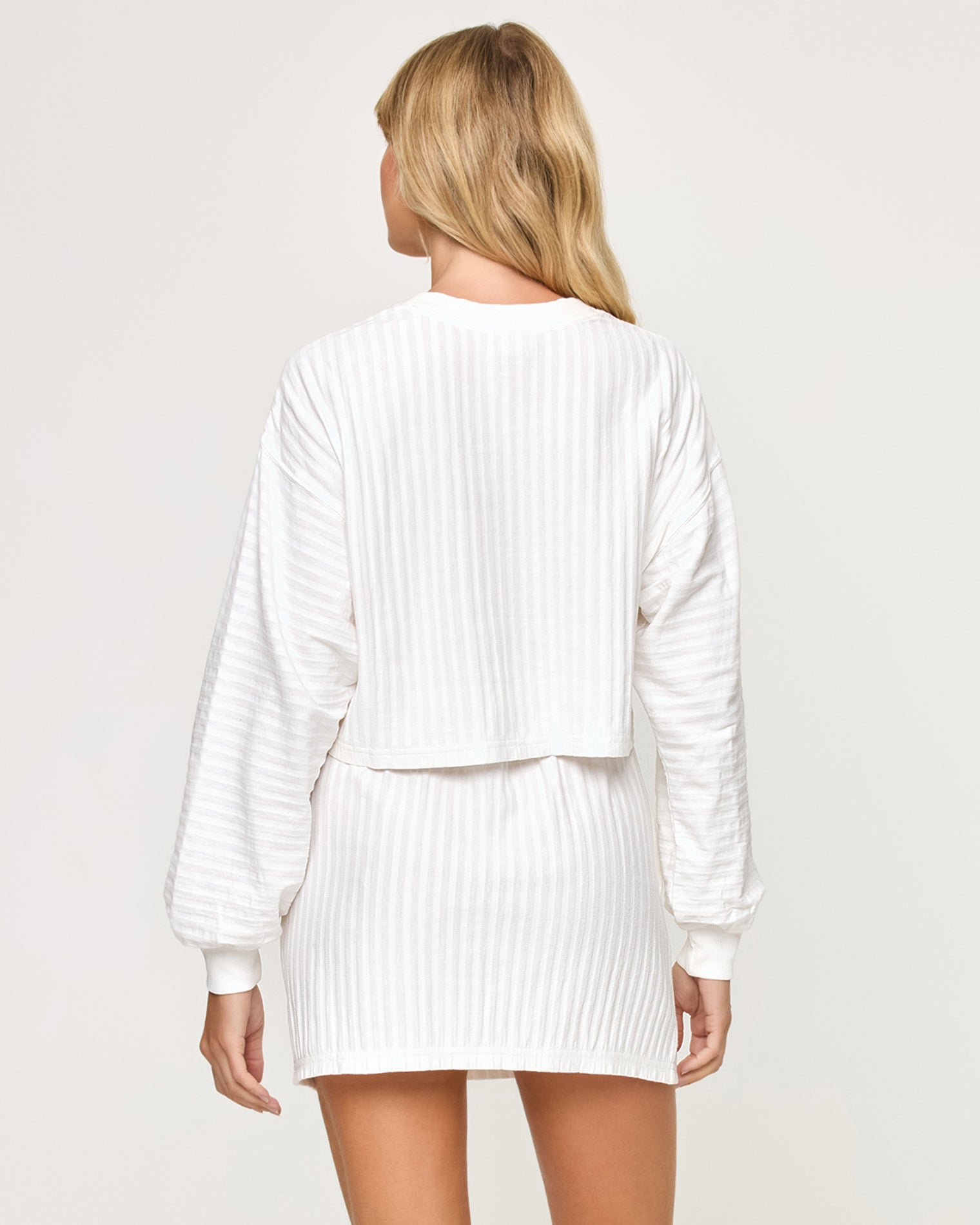 Half Court Pullover - White Back view of model wearing the Half Court Pullover in white with matching white Half Court Skirt.