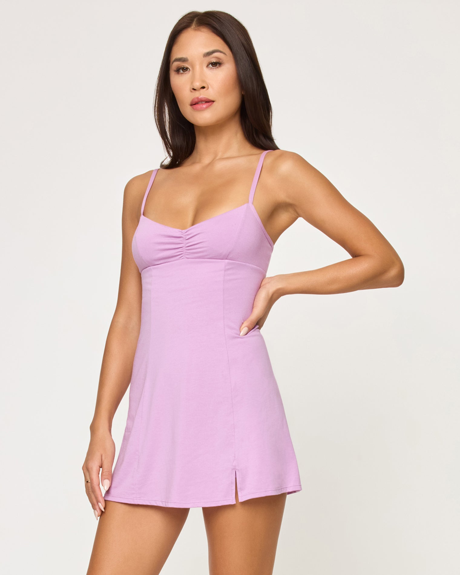 Kelsey Dress - Mauve Close-up front studio view of model wearing the Kelsey Dress in mauve, hand on hip.