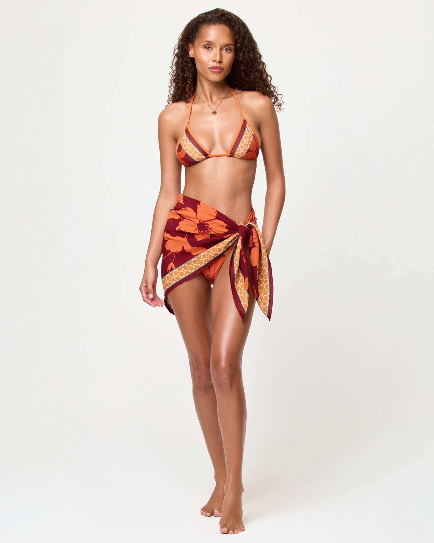 Momi Scarf - Cocobolo LSPACE Momi scarf in Cocobolo print, front view on model, tied in a mini skirt.