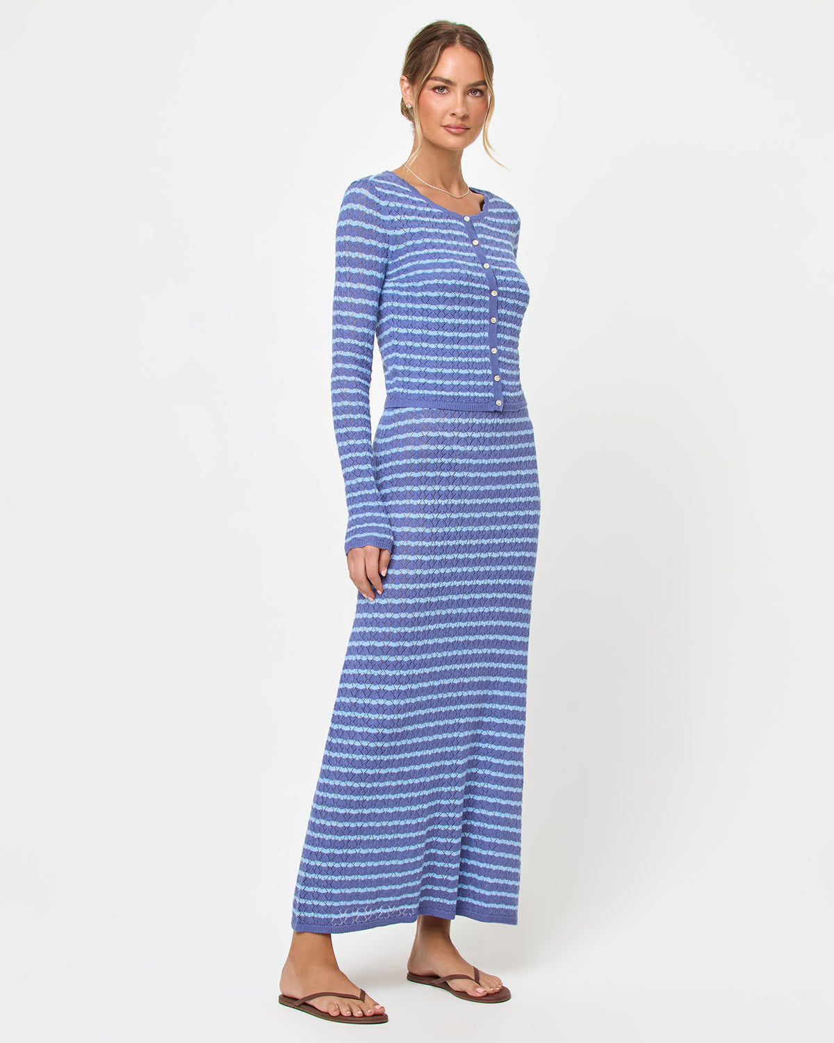 Rosalie Maxi - Blue Lagoon LSPACE Rosalie maxi dress in blue lagoon, styled with cardigan, side view on model.