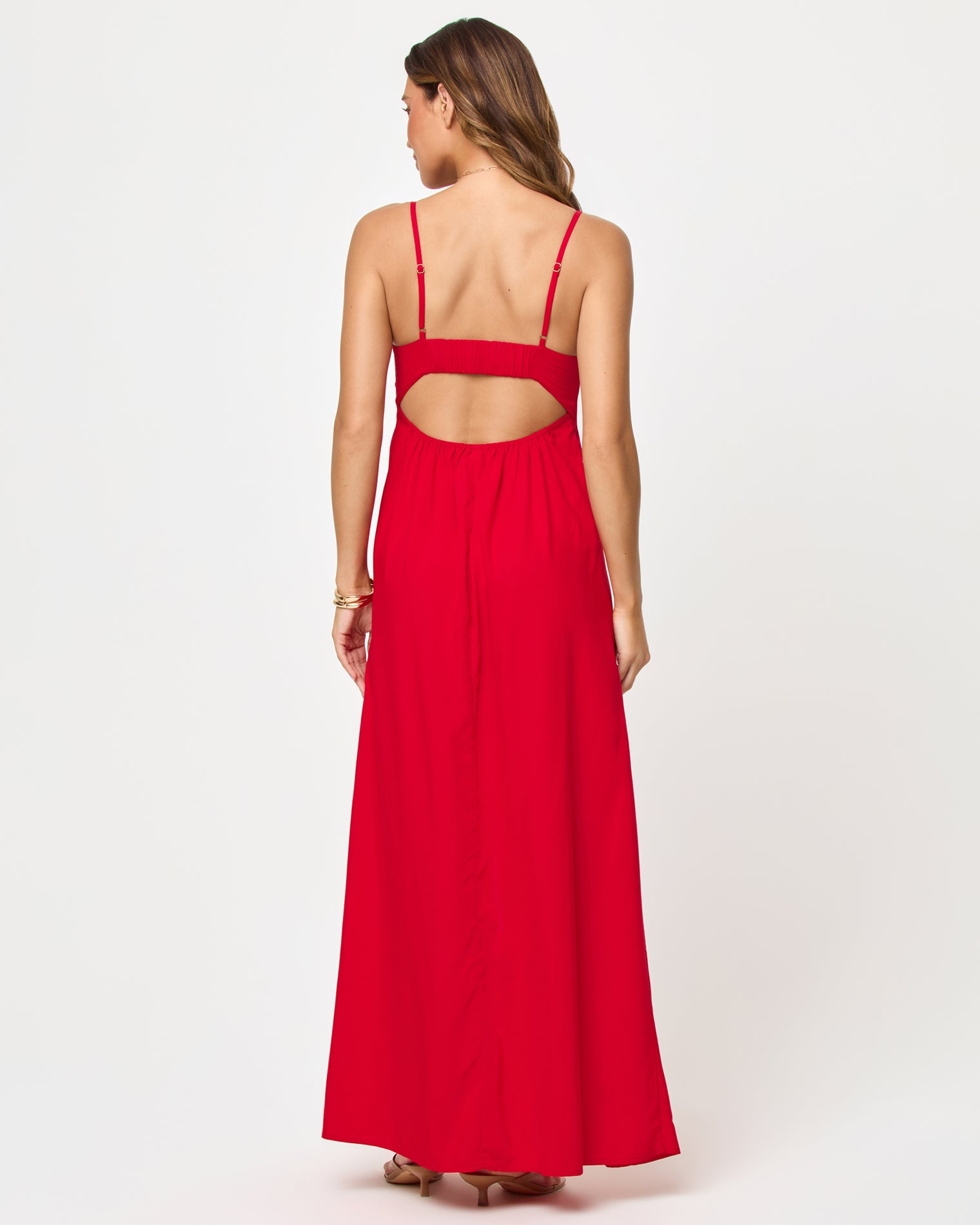 Chara Maxi Dress - Lipstick Red Back view of model wearing the LSPACE Chara Maxi Dress in lipstick red, showing the open back with spaghetti straps.
