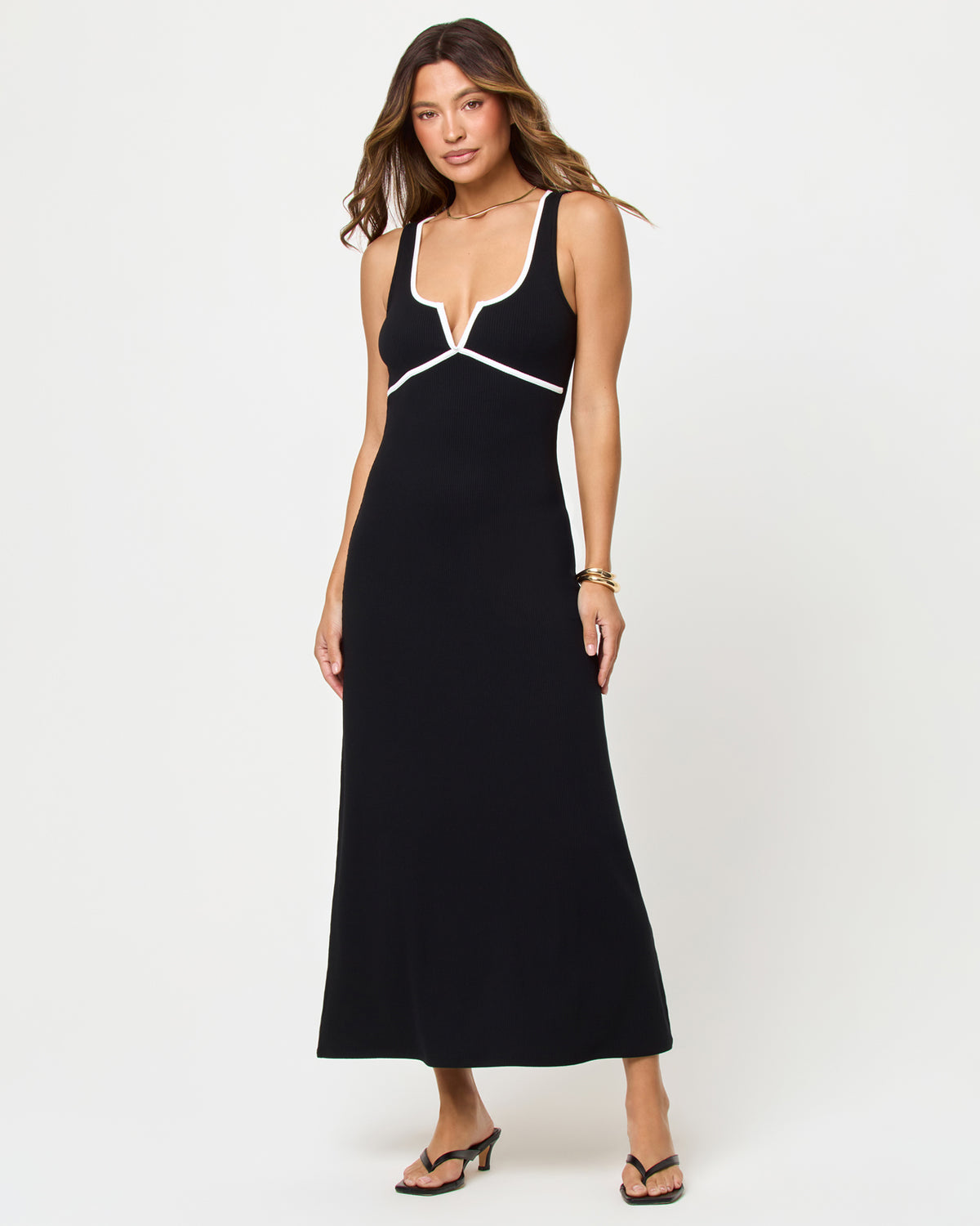 Sayge Maxi - Black-Cream Black Cream | Badge:New Arrival_#B2AC88_#ffffff'
Woman wearing a black dress with white accents on a white background