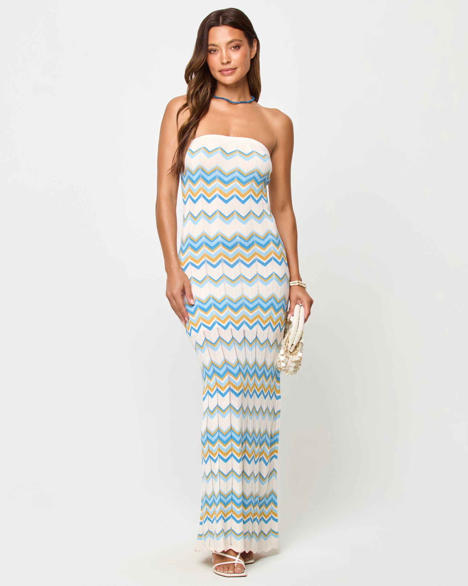 Hallie Maxi - Gold Coast Gold Coast | Badge:New Arrival_#B2AC88_#ffffff'
LSPACE Hallie Maxi in Gold Coast stripe, front view on model carrying woven bag.
