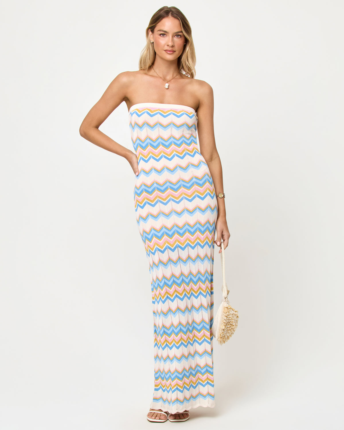 Hallie Maxi - Gold Coast Gold Coast | Badge:New Arrival_#B2AC88_#ffffff'
LSPACE Hallie Maxi in Gold Coast stripe, front view on model carrying woven bag.