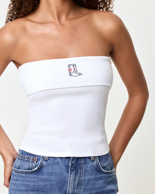 Close-up of the LSPACE Andie Top in yallspace, highlighting the embroidered cowboy boot graphic on the white ribbed strapless tube top with fold-over edge detail.