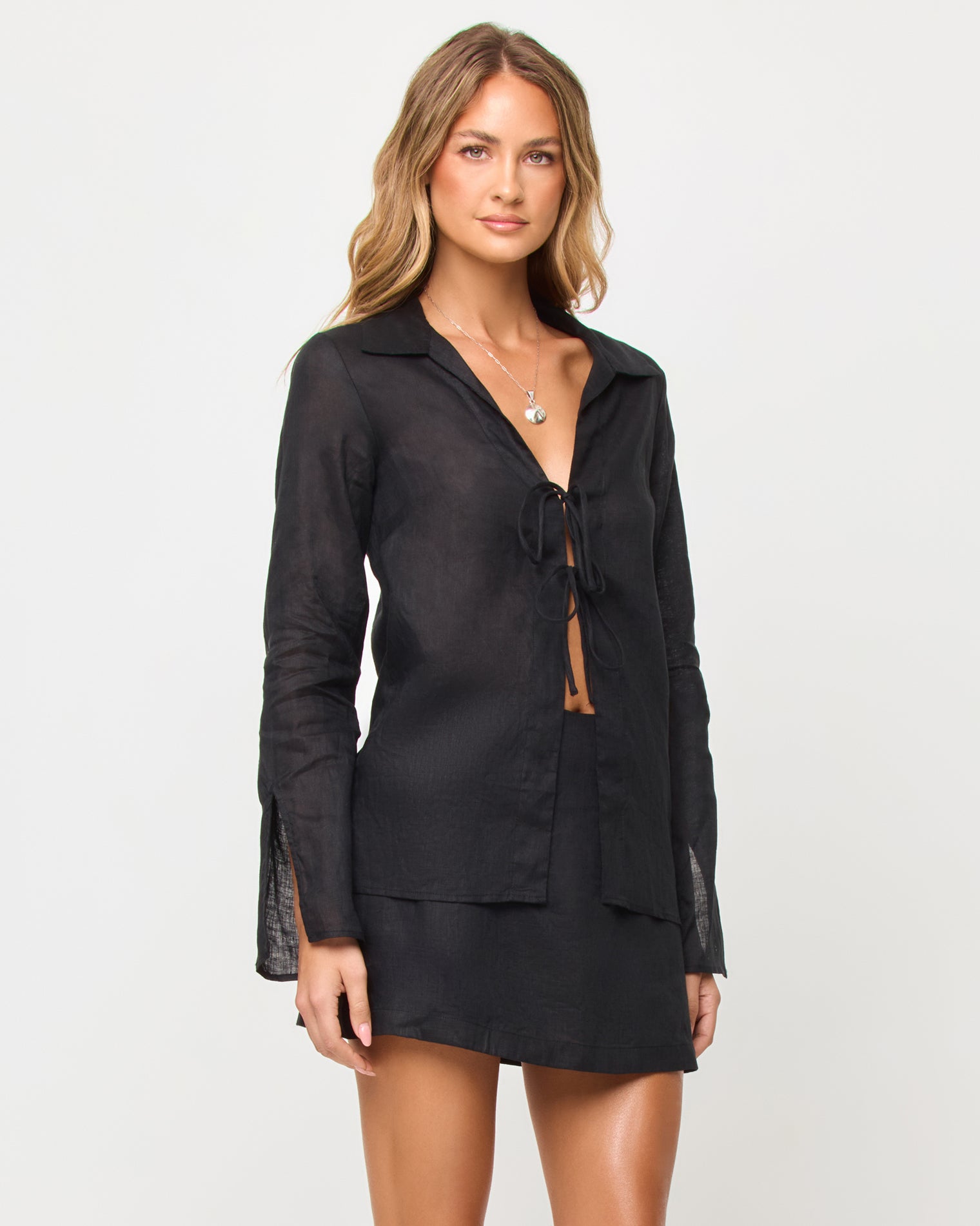 Venice Skort - Black Woman wearing a black set on a white background