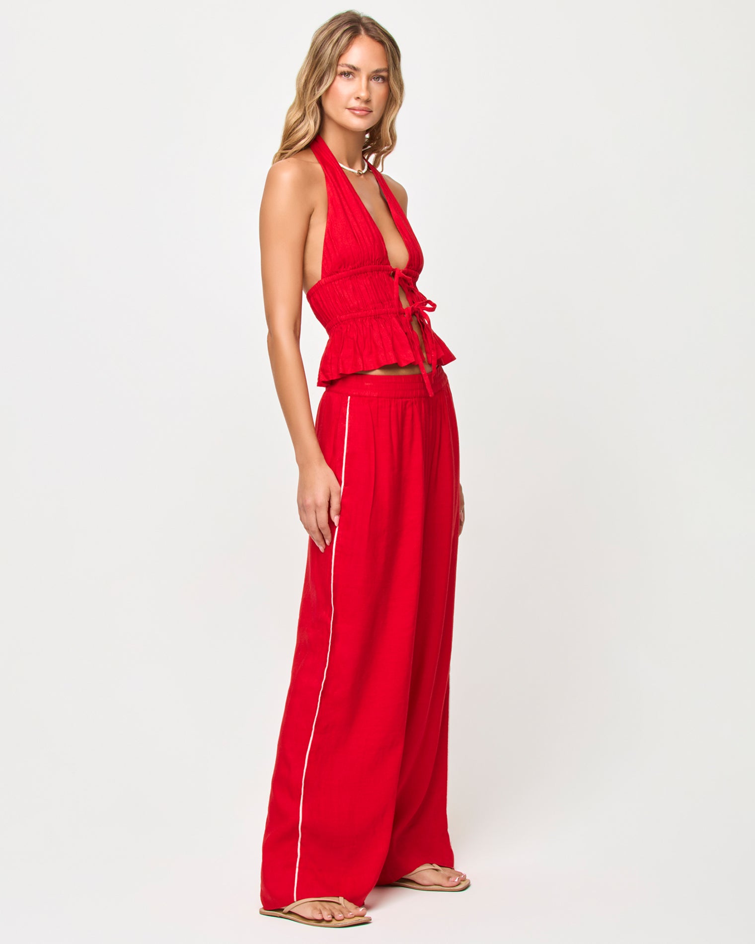 x The Salty Blonde August Top - Flame Side view of model wearing the LSPACE x The Salty Blonde August Top in flame.