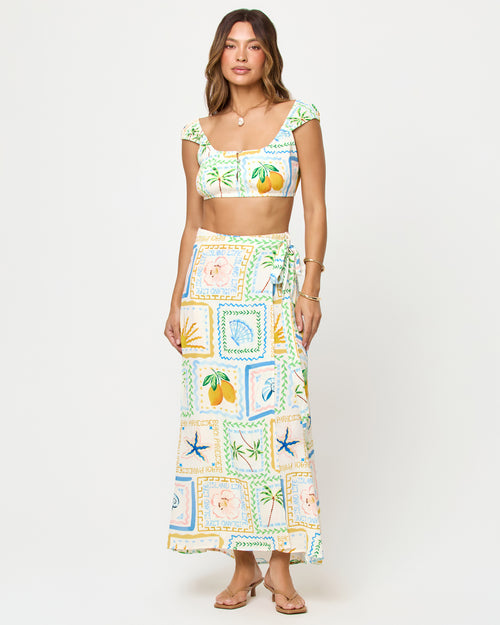 
LSPACE Ever Top and Every Wrap Skirt in Wish You Were Here print, front view on model.