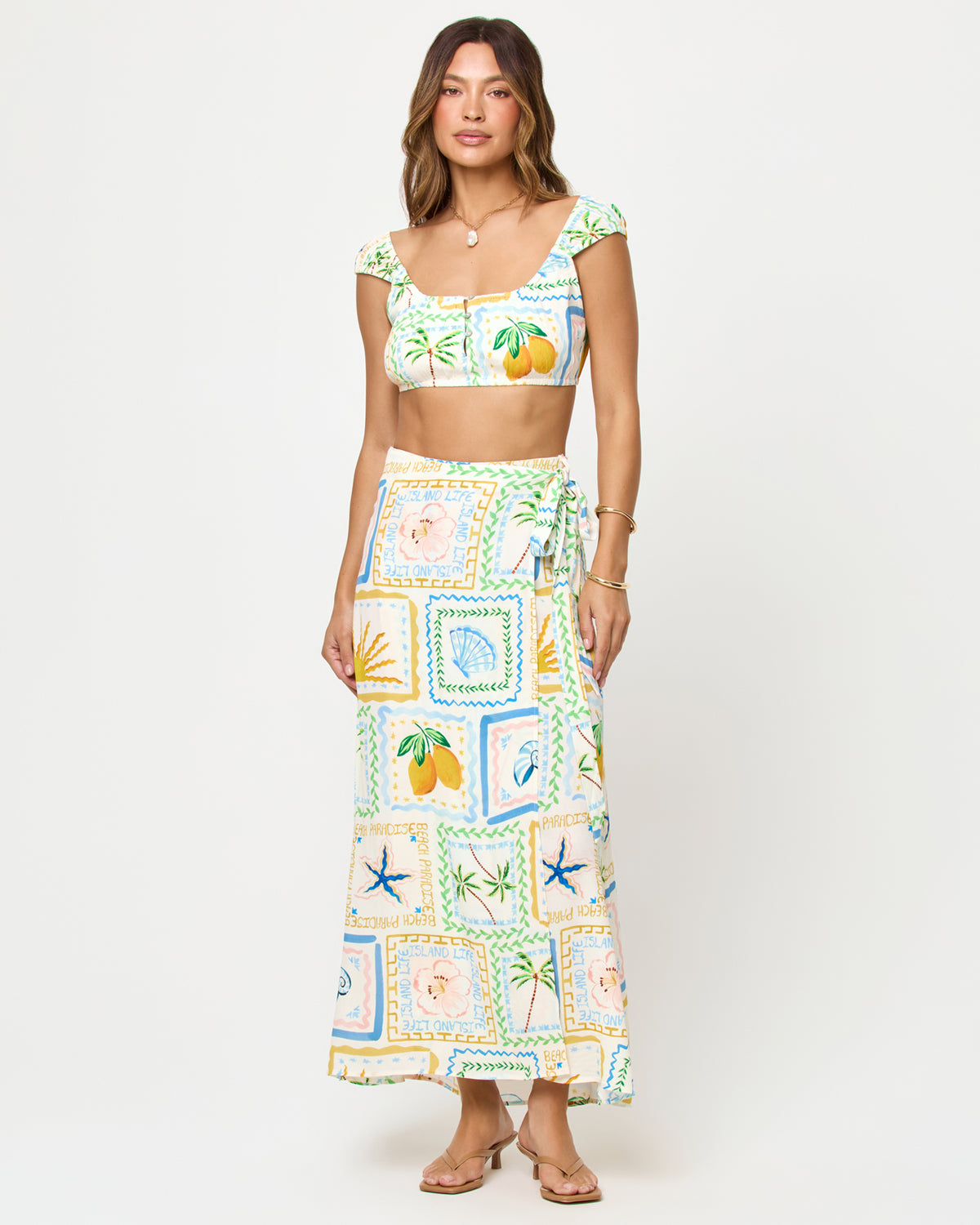 Ever Top - Wish You Were Here Wish You Were Here | Badge:New Arrival_#B2AC88_#ffffff'
LSPACE Ever Top and Every Wrap Skirt in Wish You Were Here print, front view on model.
