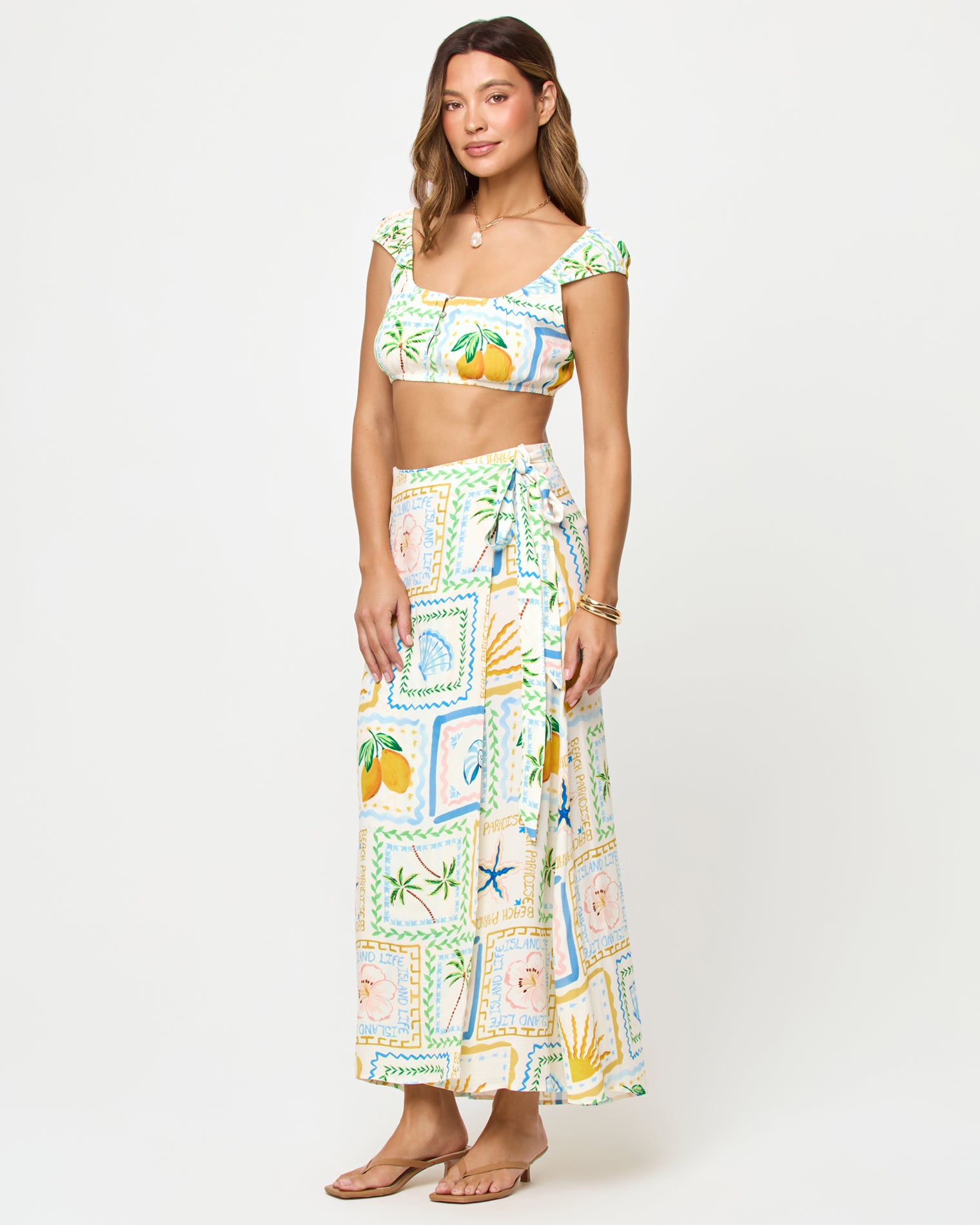Ever Top - Wish You Were Here LSPACE Ever Top and Every Wrap Skirt in Wish You Were Here print, three-quarter view on model.