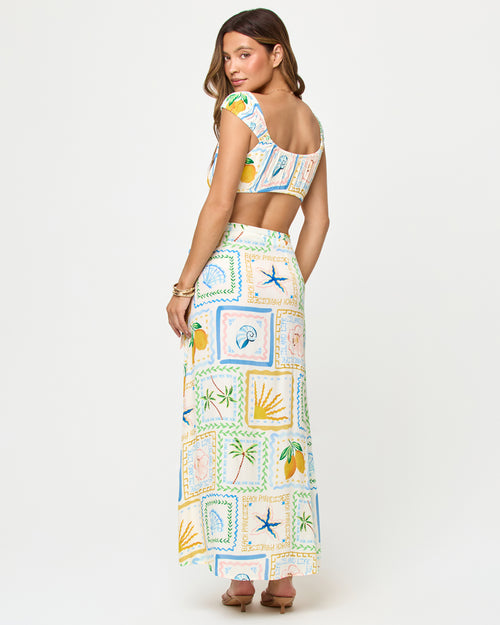 LSPACE Ever Top and Every Wrap Skirt in Wish You Were Here print, back view on model.