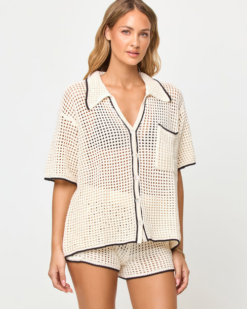 LSPACE Scout short in Cream-Black, three-quarter view on model.