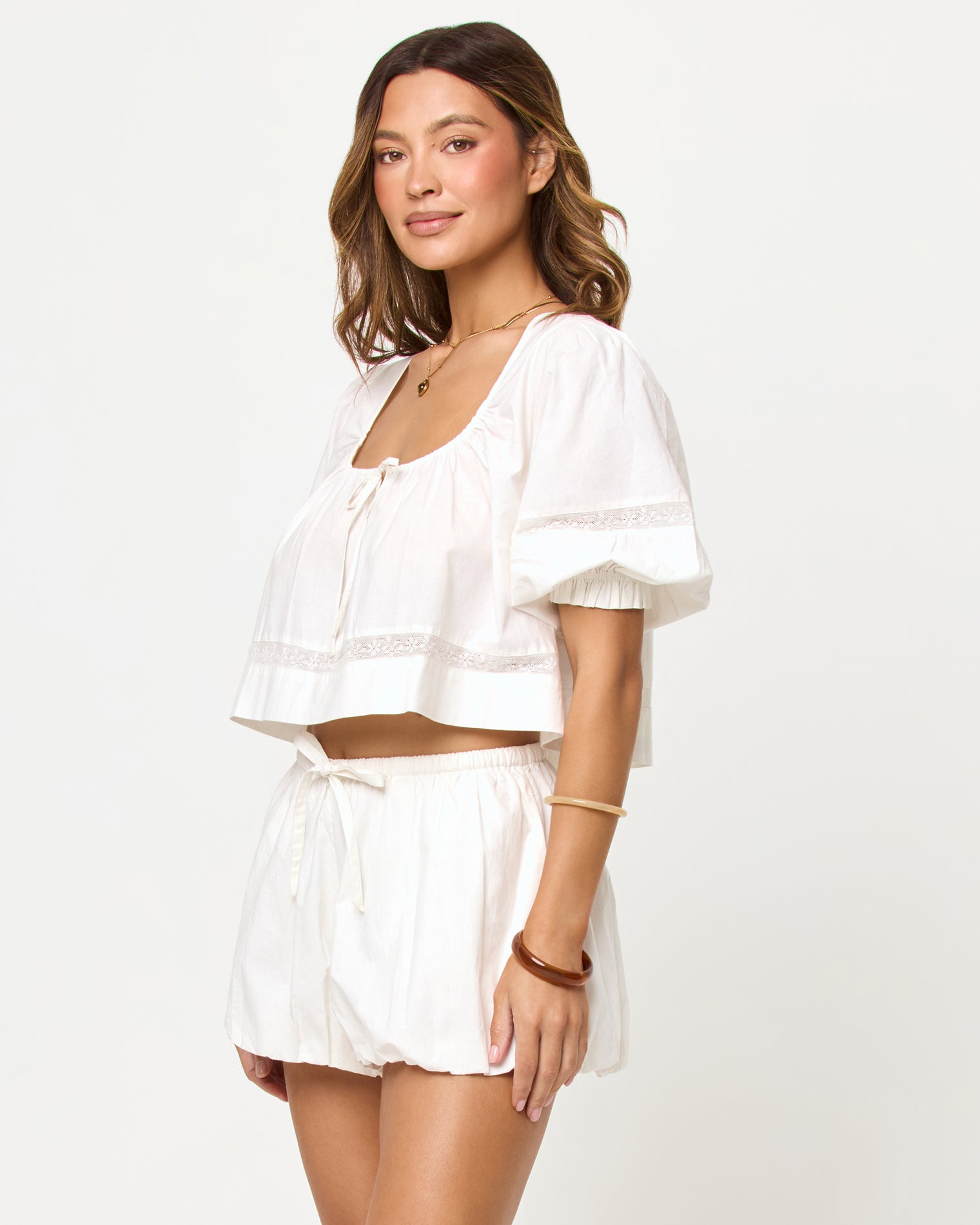Lucie Short - Cream LSPACE Lucie Short in cream, three-quarter view on model.