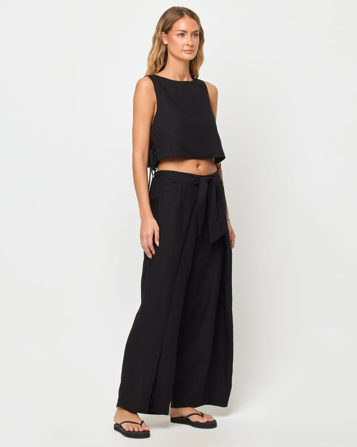Rylee Pant - Black LSPACE Rylee top in black, three-quarter view on model.