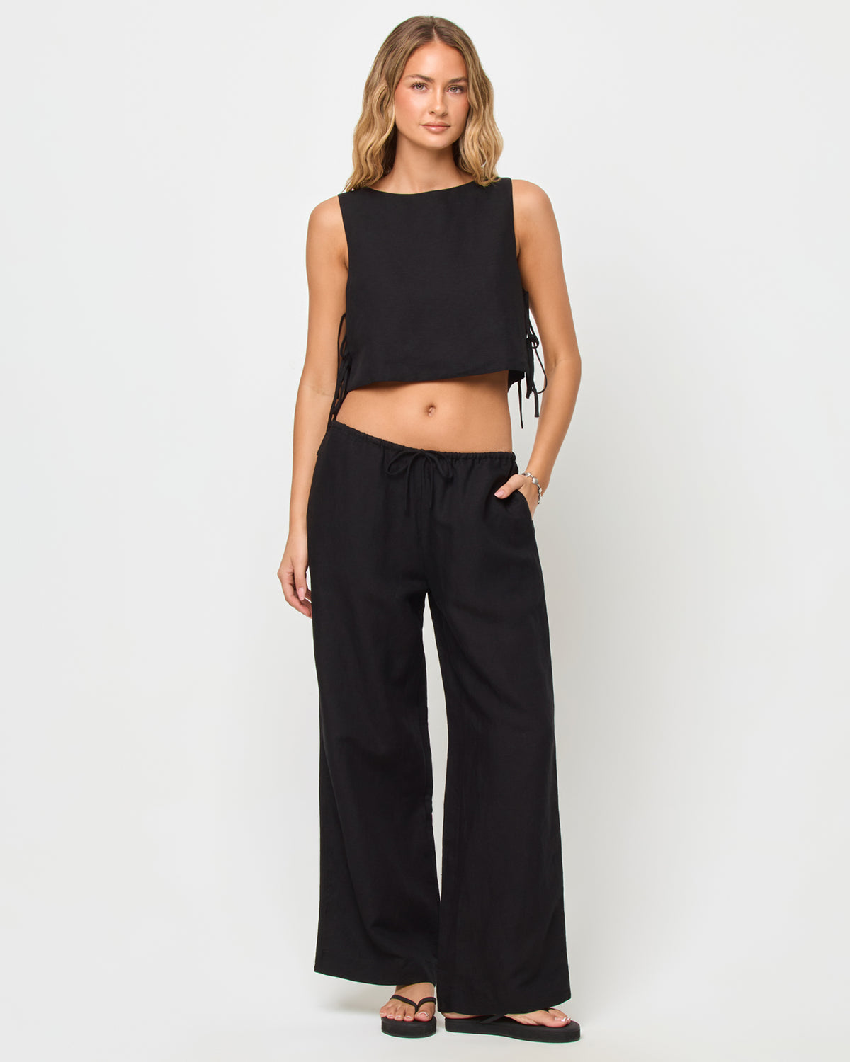 Nina Pant - Black LSPACE Nina Pant in black with sleeveless tank top, front view on model.