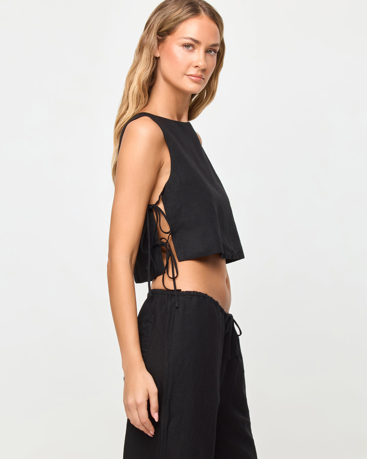 Rylee Top - Black LSPACE Rylee top in black, side view on model.