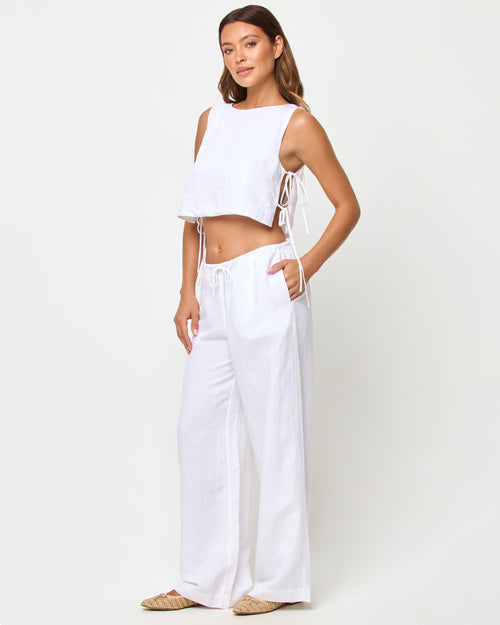 LSPACE Nina Pant in white, three-quarter view on model.