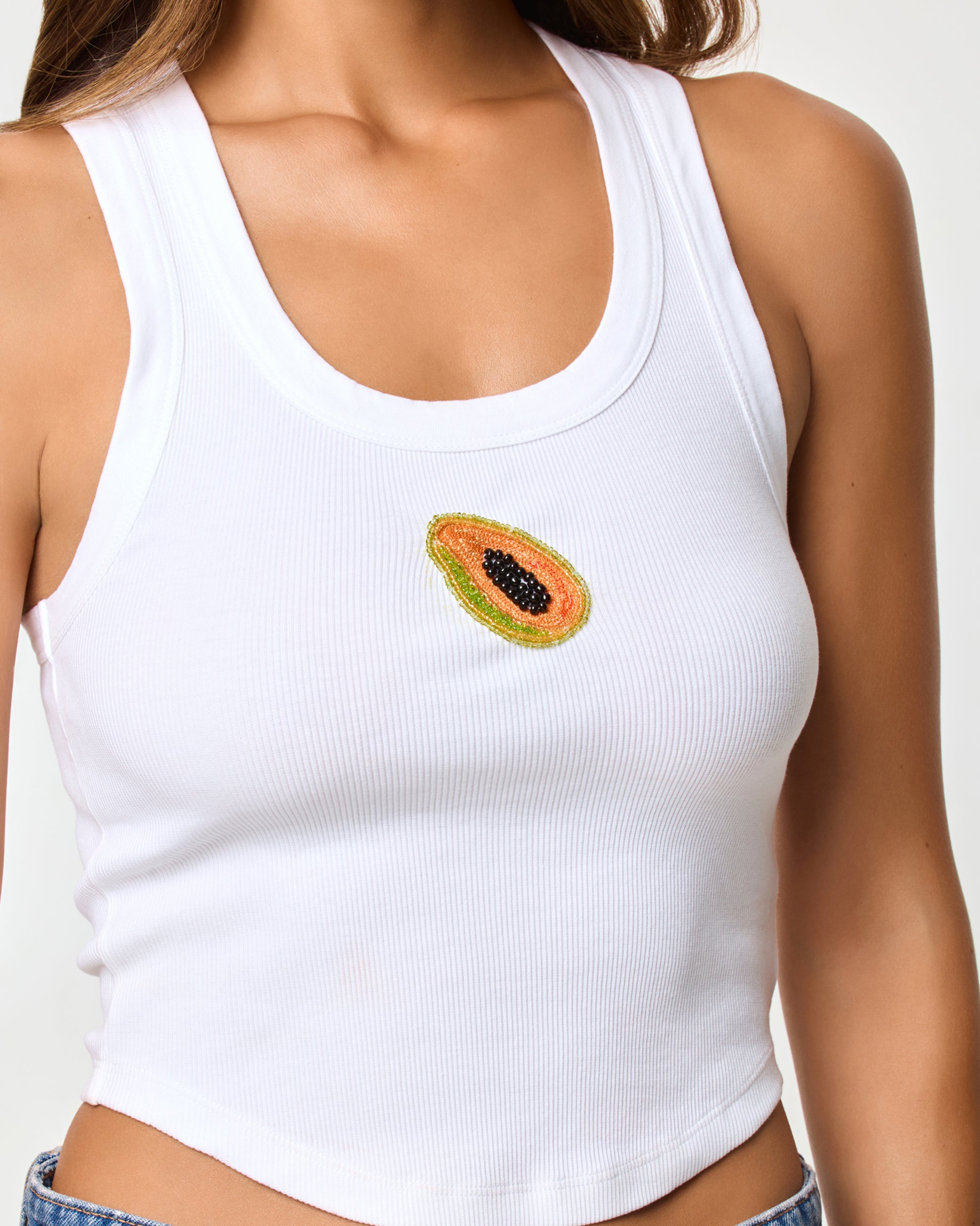 Ash Tank - Papaya Close-up of the LSPACE Ash Tank in papaya showing the ribbed texture and neckline detail.