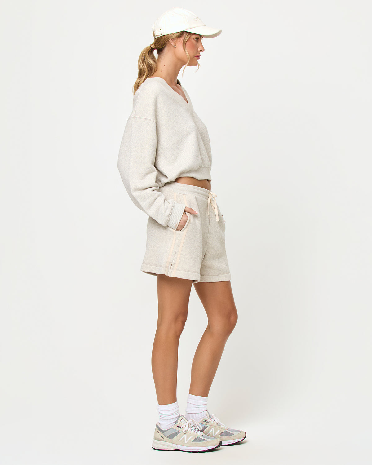 Bennett Short - Heather Gray LSPACE Vaughn sweatshirt and Bennett Short in heather gray, side view on model.