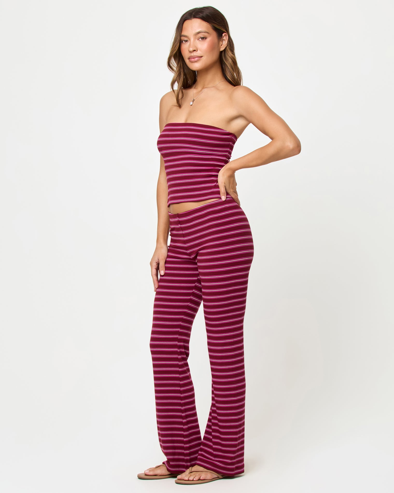 Zinnia Top - Sipping Sangria Stripe LSPACE Zinnia Top in Sipping Sangria Stripe, three-quarter view on model.