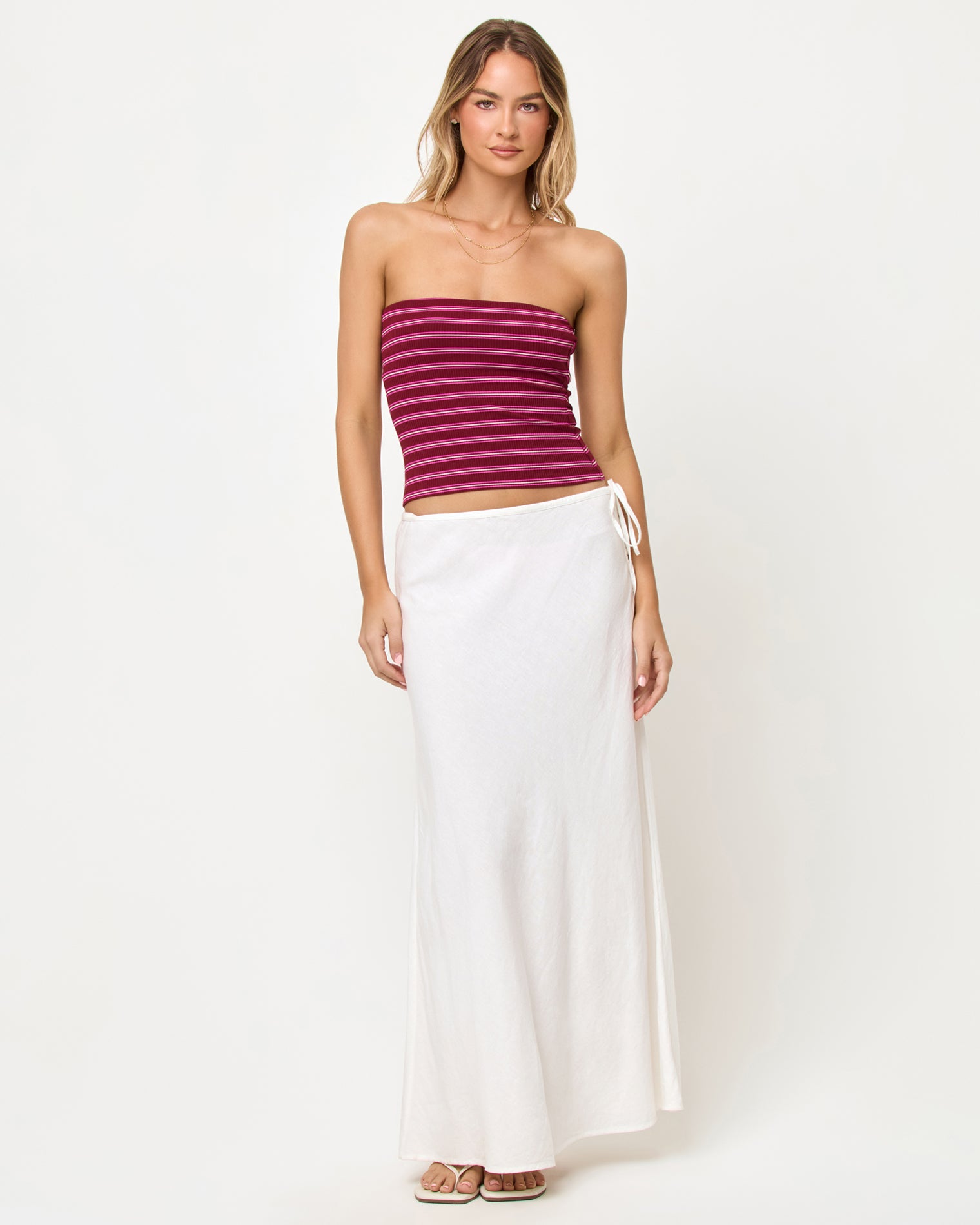 Zinnia Top - Sipping Sangria Stripe LSPACE Zinnia Top in Sipping Sangria Stripe, front view on model styled with white maxi skirt.
