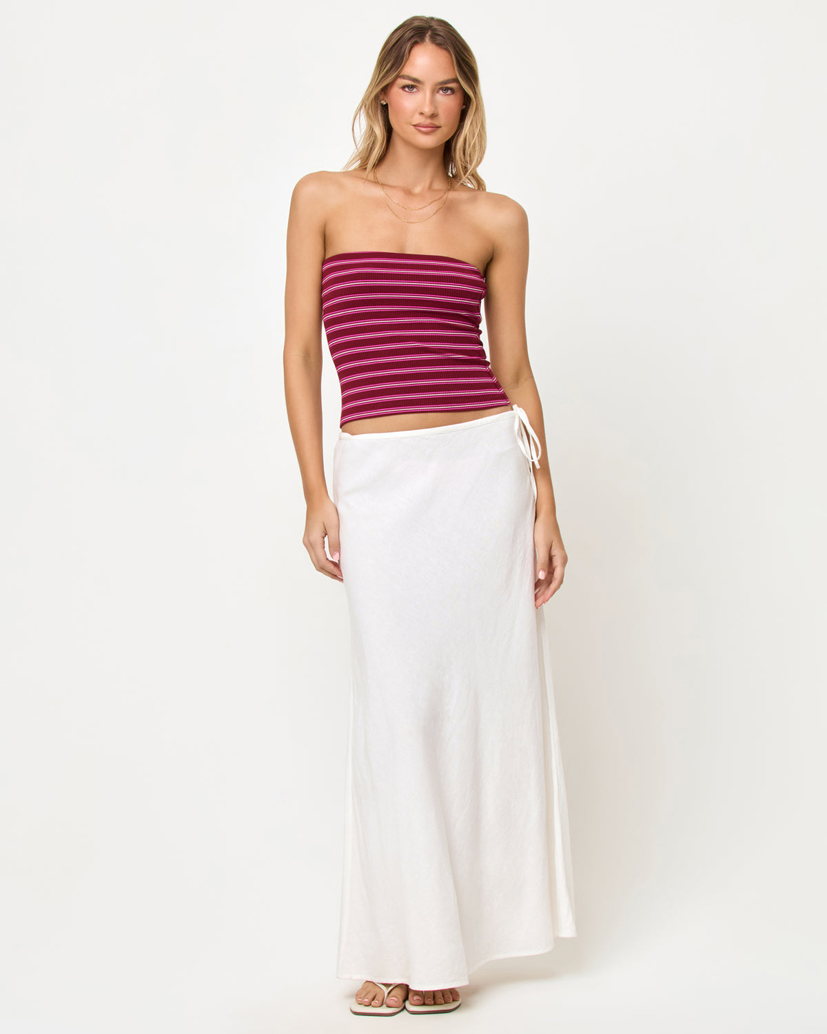 Zinnia Top - Sipping Sangria Stripe LSPACE Zinnia Top in Sipping Sangria Stripe, front view on model styled with white maxi skirt.