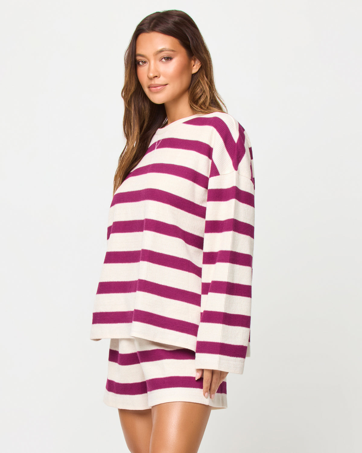 Maeve Top - Berry Jam Cream LSPACE Maeve top in Berry Jam Cream print, three-quarter view on model.