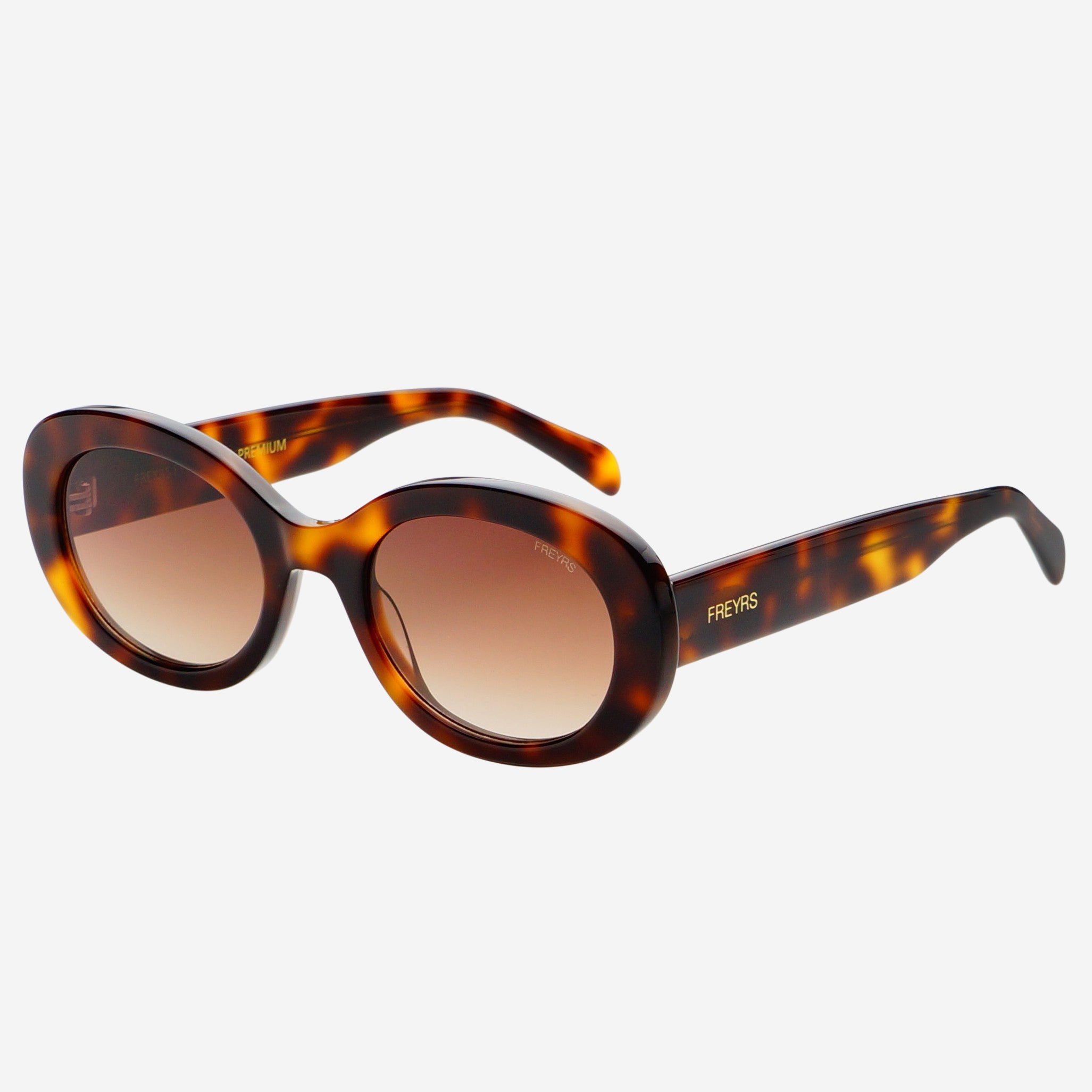 Freyrs Aria Sunglasses - Brown Off-model angled view of the Freyrs Aria Sunglasses in brown showing the oval tortoise frame and brown gradient lenses.