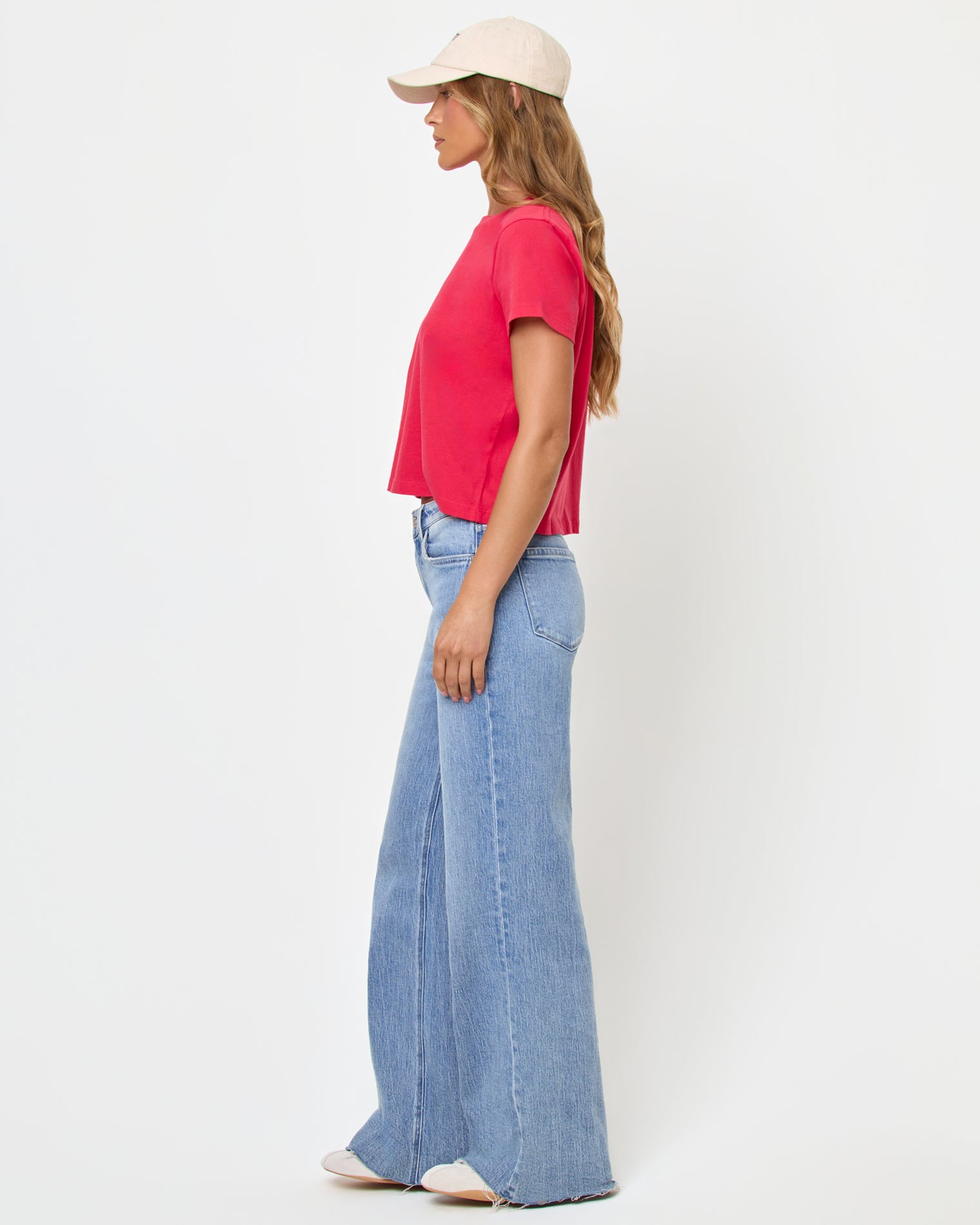 All Day Top - Pout side-view of woman wearing boxy bright pink t-shirt