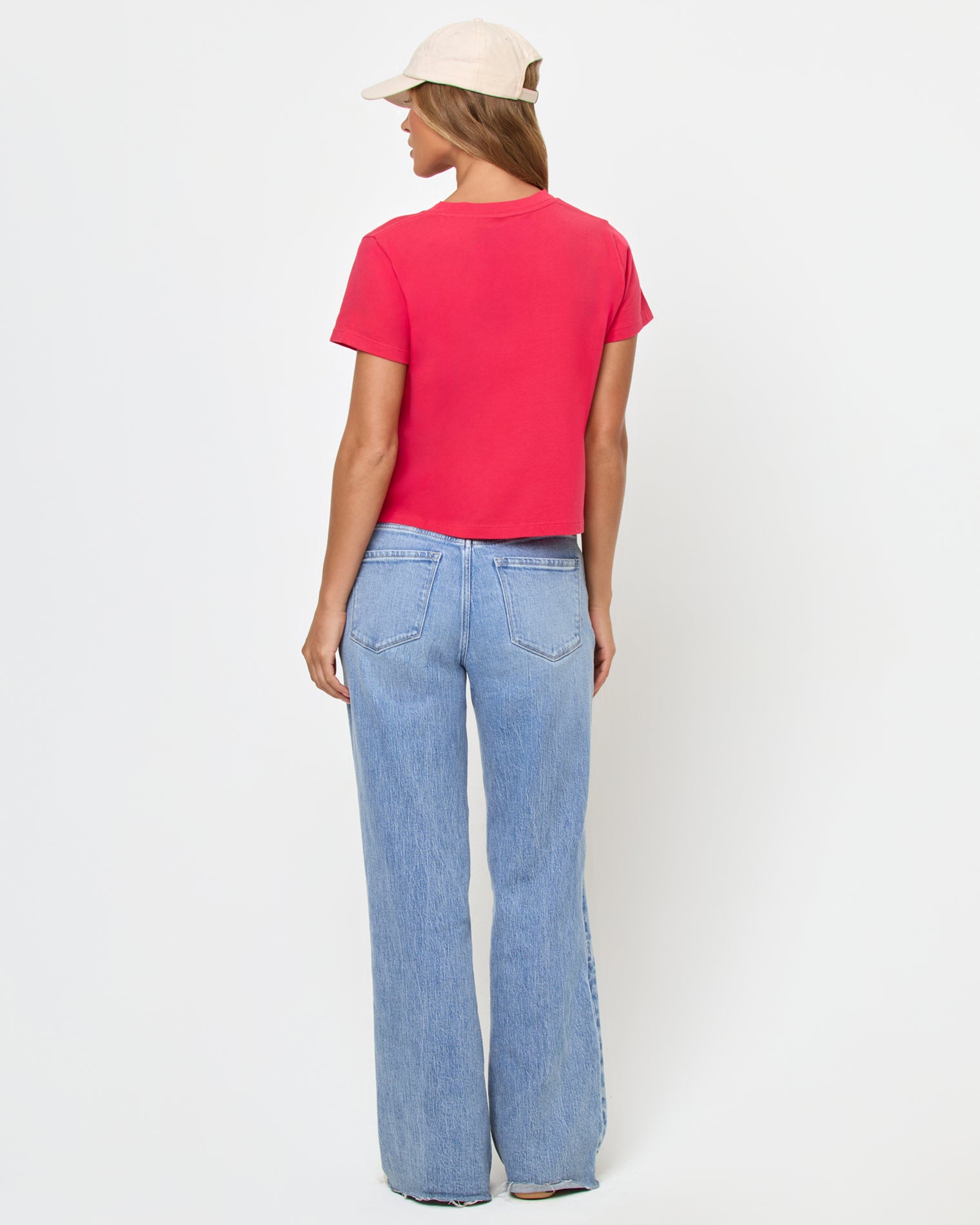 All Day Top - Pout back-view of woman wearing boxy bright pink t-shirt