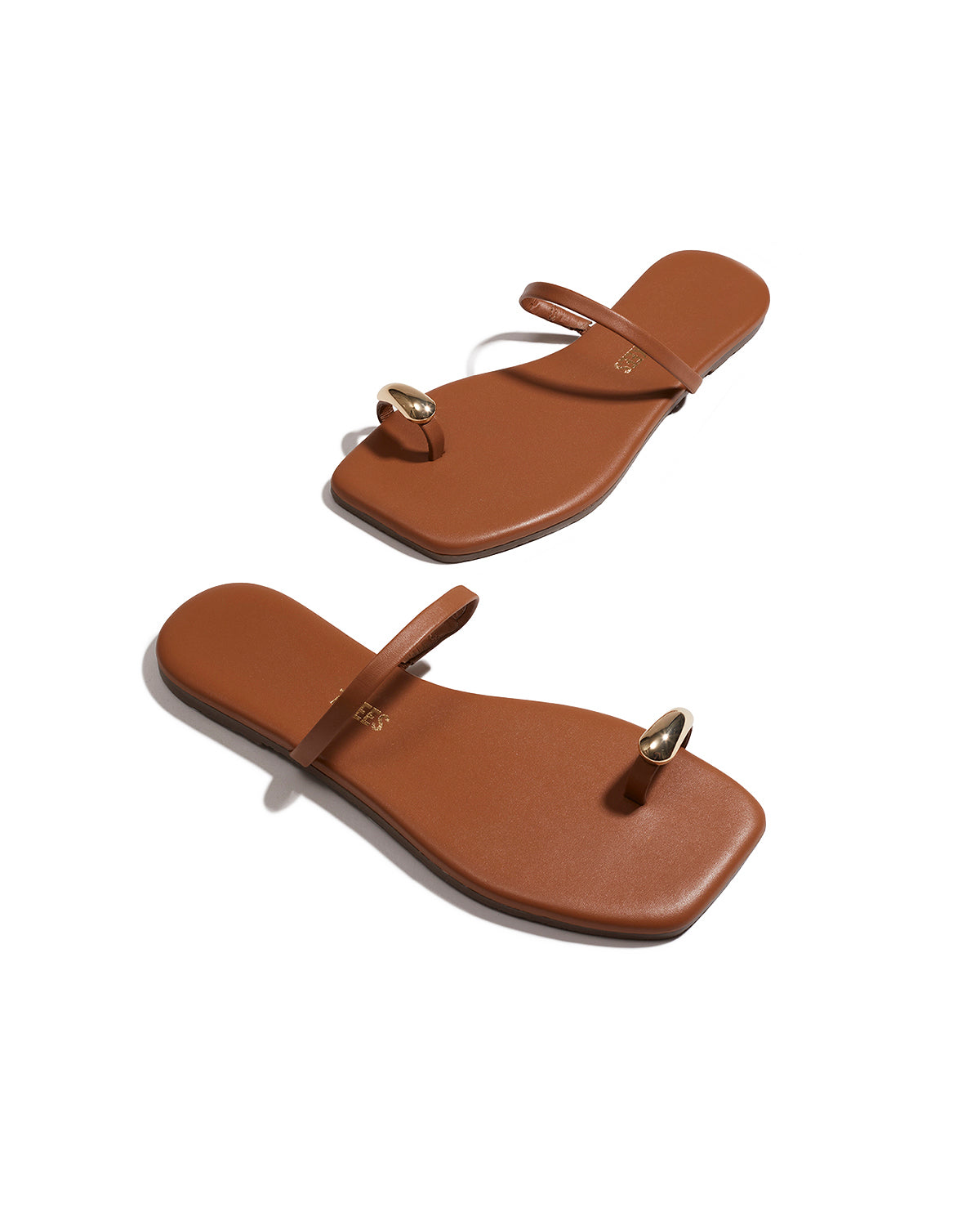 TKEES Colette Sandals - Natural Angled view of both natural TKEES Colette Sandals showing the thong strap and footbed.