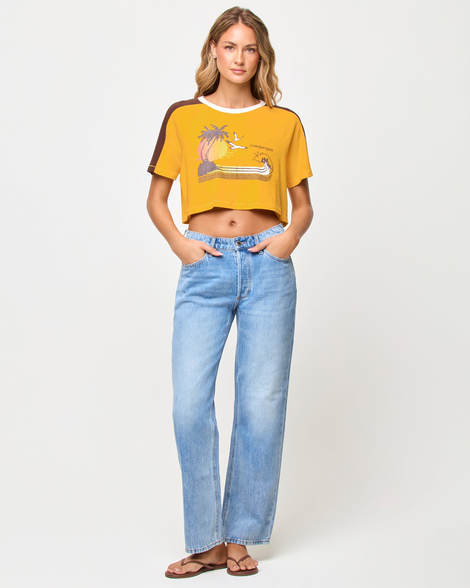 x The Salty Blonde Costa Crop Top - Cabo Sunset Front view of model wearing the LSPACE x The Salty Blonde Costa Crop Top in cabo sunset, a cropped top in a warm sunset colorway.