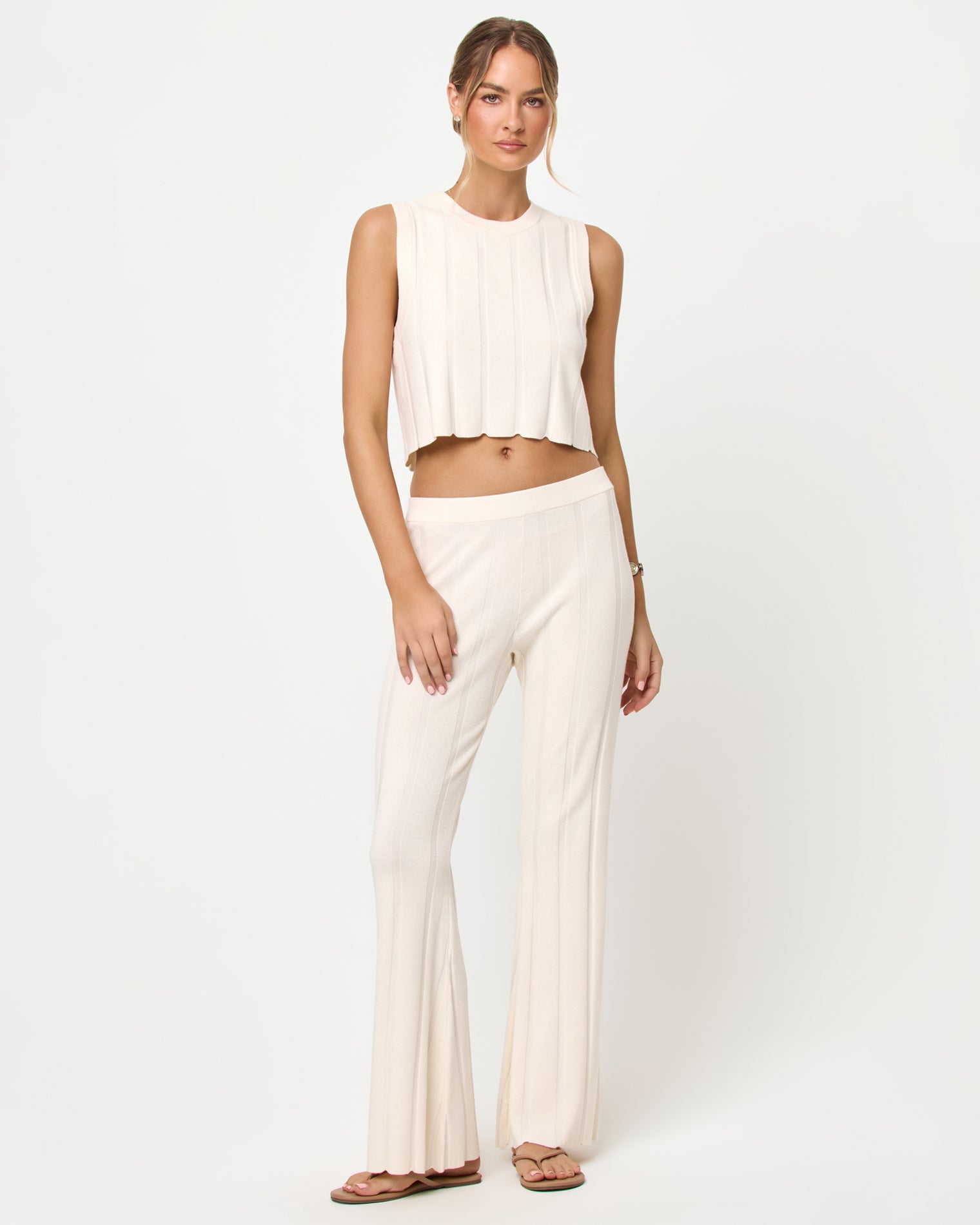 Iris Pant - Tapioca Tapioca | Badge:New Arrival_#B2AC88_#ffffff'

LSPACE Iris pant and En Route Top in tapioca, front view on model.