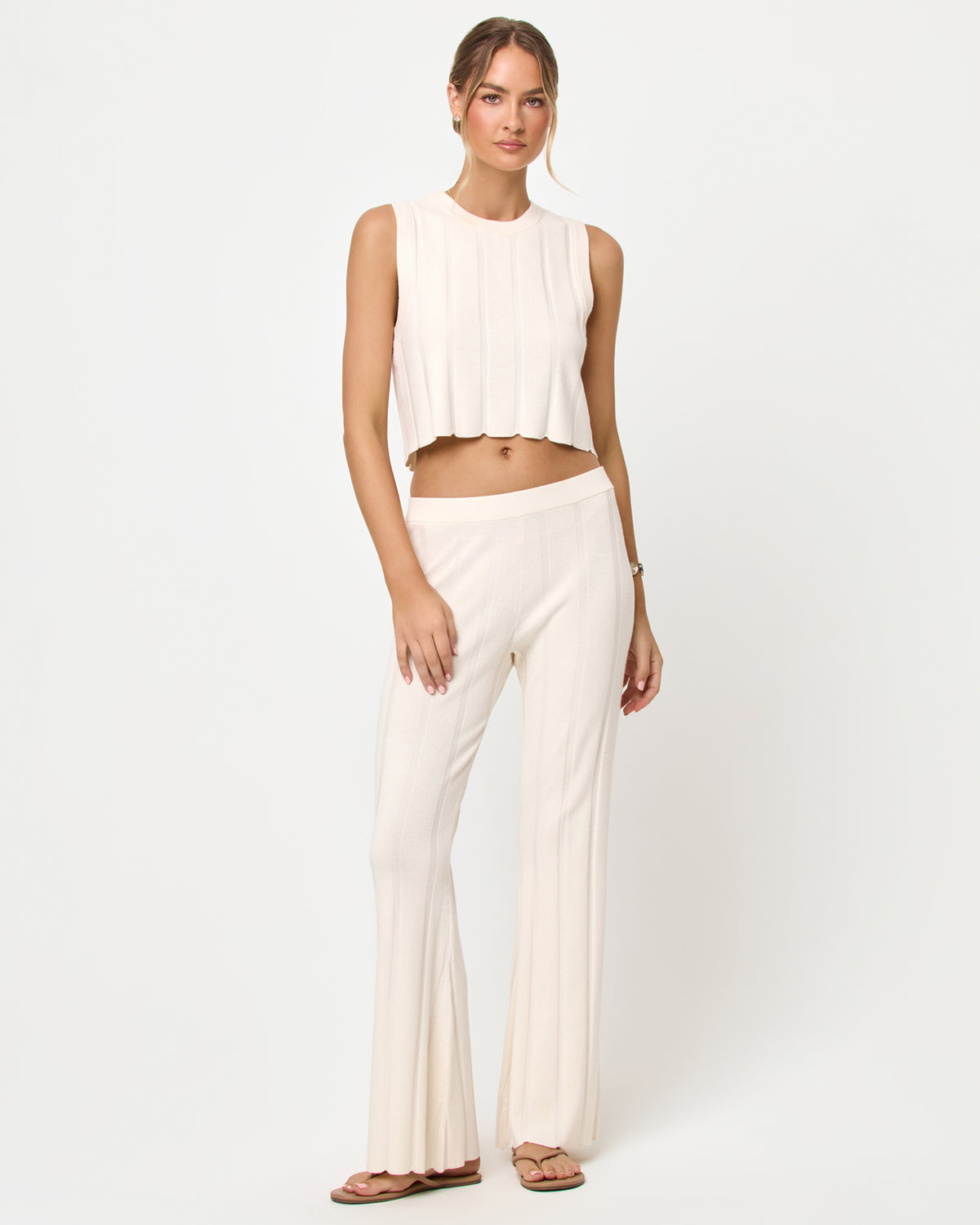 Iris Pant - Tapioca Tapioca | Badge:New Arrival_#B2AC88_#ffffff'

LSPACE Iris pant and En Route Top in tapioca, front view on model.