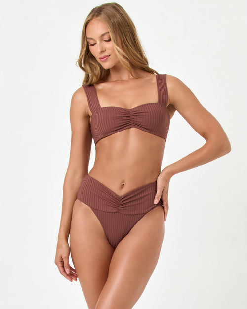 Front view of a model wearing the LSPACE cafe Marlee Bikini Top with matching cafe Bardot Bikini Bottom.