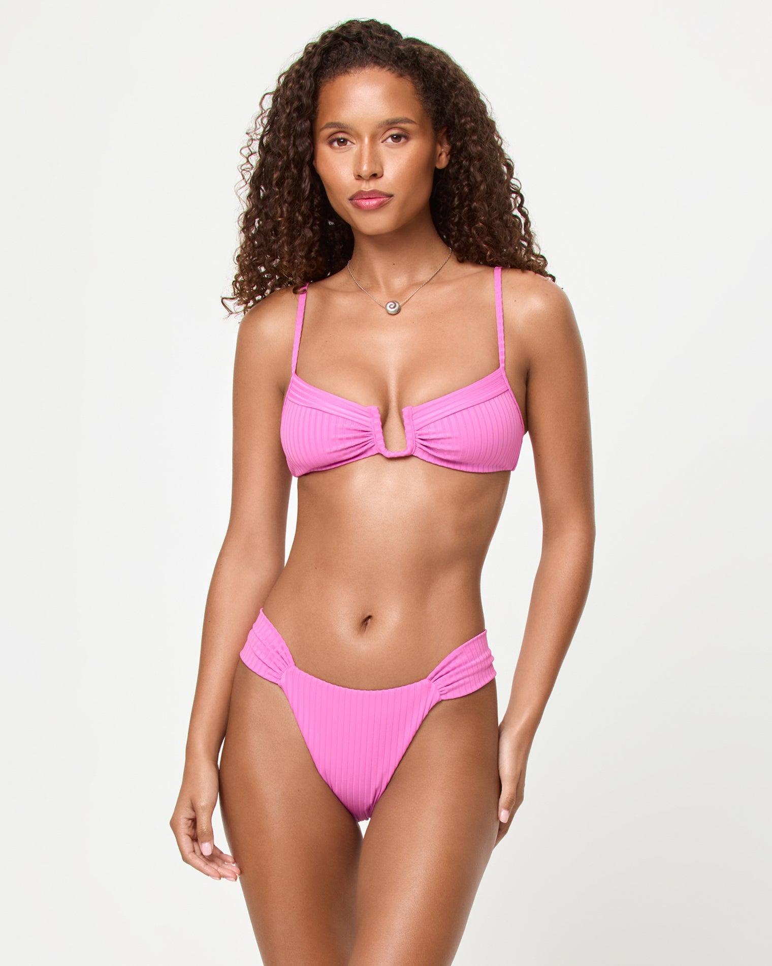 Peyton Bikini Top - Sweetheart Front view of a model wearing the LSPACE Sweetheart Peyton Bikini Top with ribbed fabric and center front twist detail.
