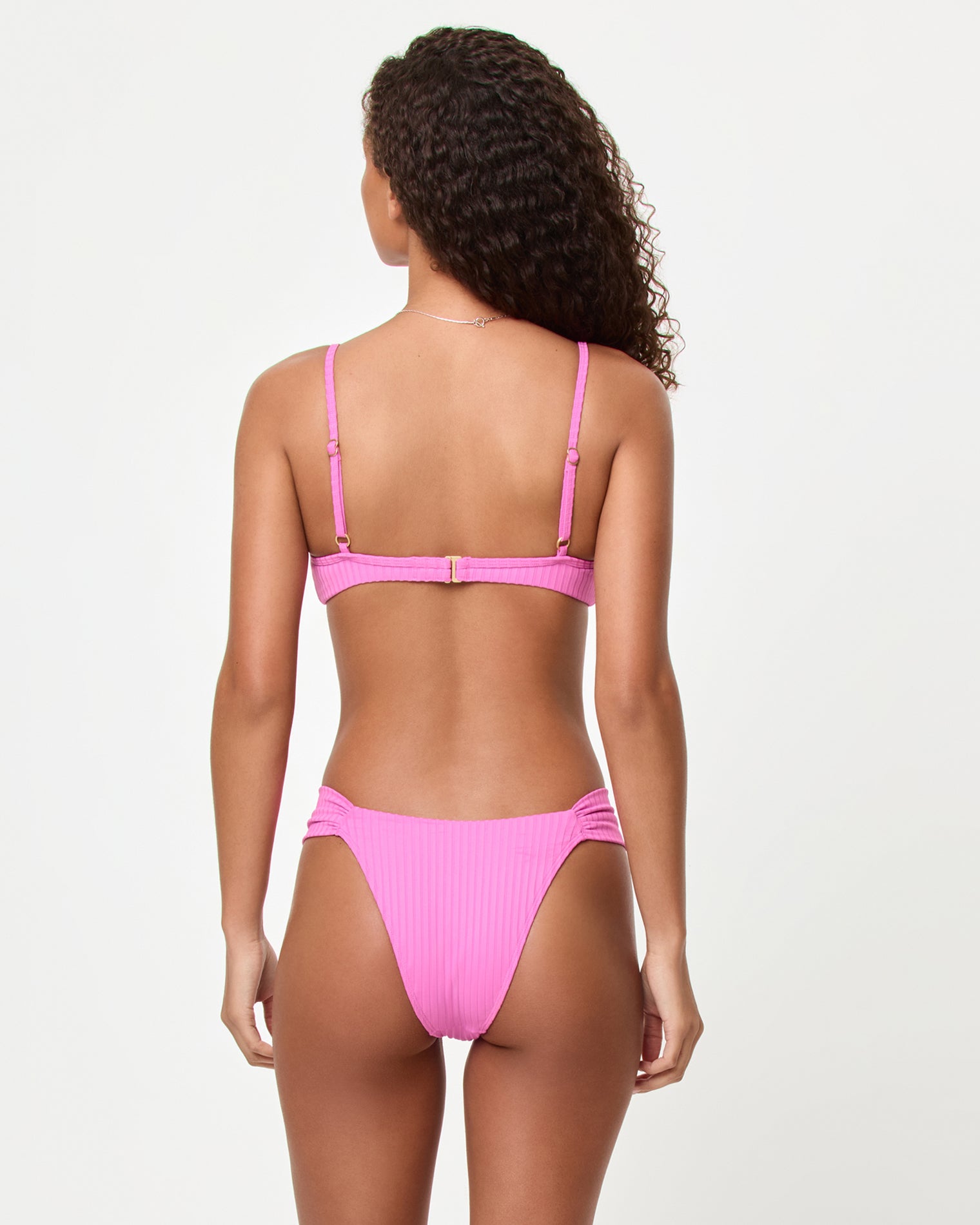 Peyton Bikini Top - Sweetheart Back view of a model wearing the LSPACE Sweetheart Peyton Bikini Top with ribbed fabric and adjustable back closure.