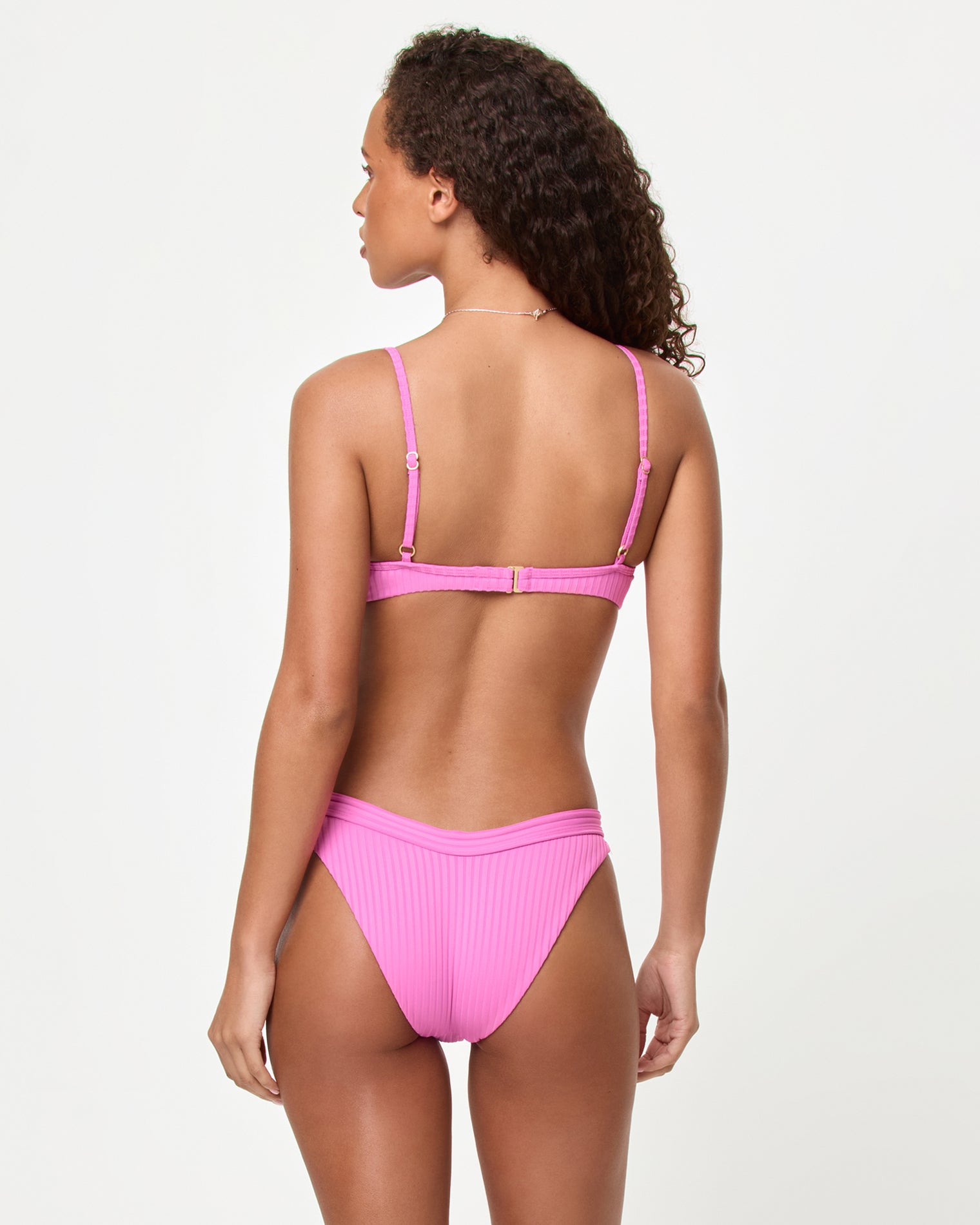 Mercer Bikini Bottom - Sweetheart Back view of a model wearing the LSPACE Sweetheart Mercer Bikini Bottom with ribbed fabric.