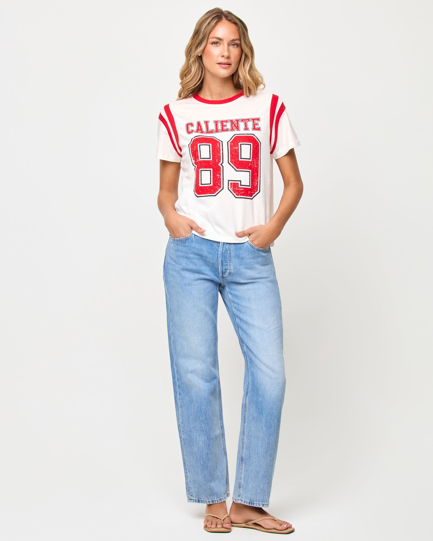 x The Salty Blonde Fresca Tee - Caliente Front view of model wearing the LSPACE x The Salty Blonde Fresca Tee in caliente, a cropped graphic tee in a warm red tone.