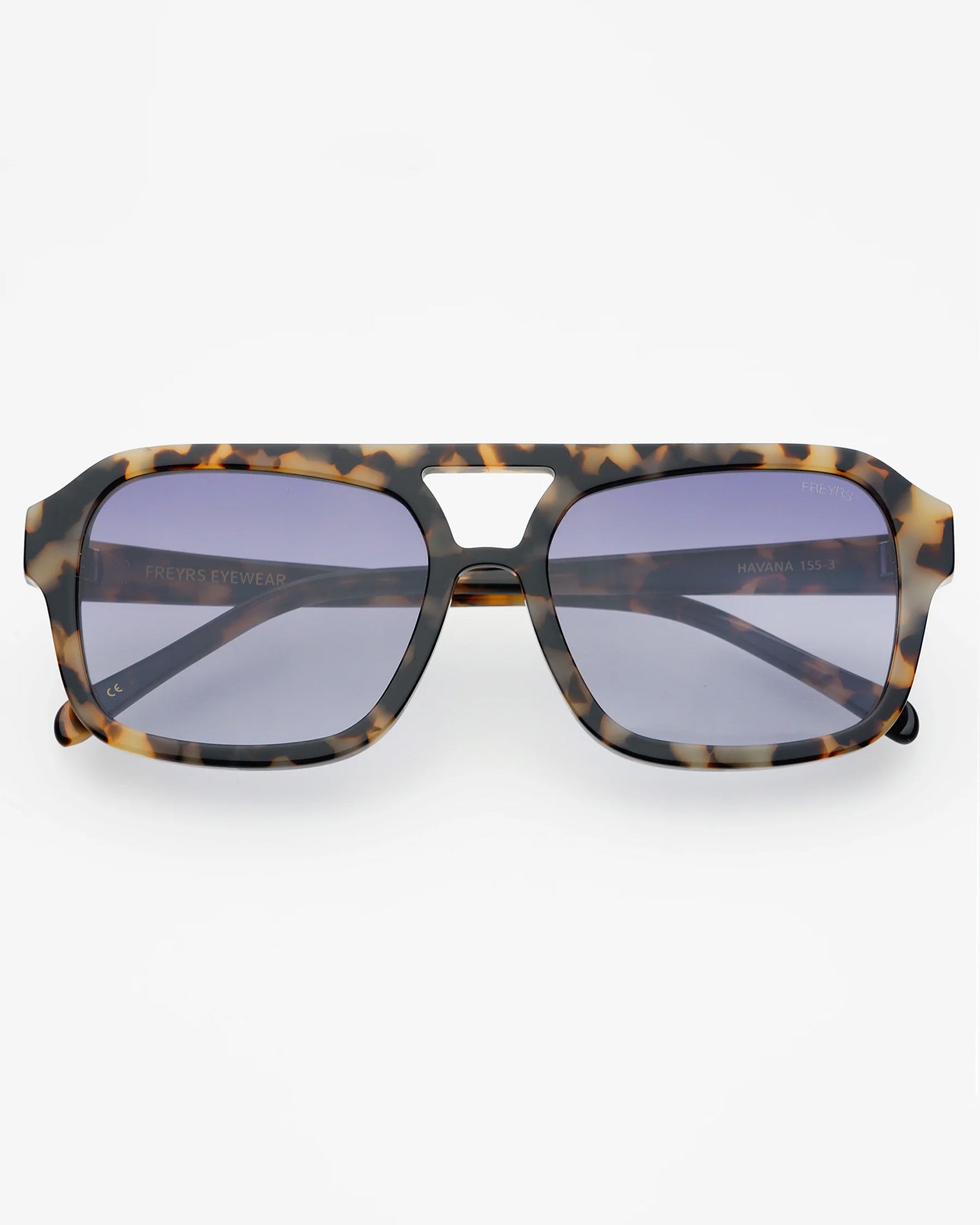 Freyrs Havana Sunglasses - Tortoise Off-model image of the Freyrs Havana Sunglasses in tortoise, folded flat with square tortoise acetate frame and blue-tinted lenses.