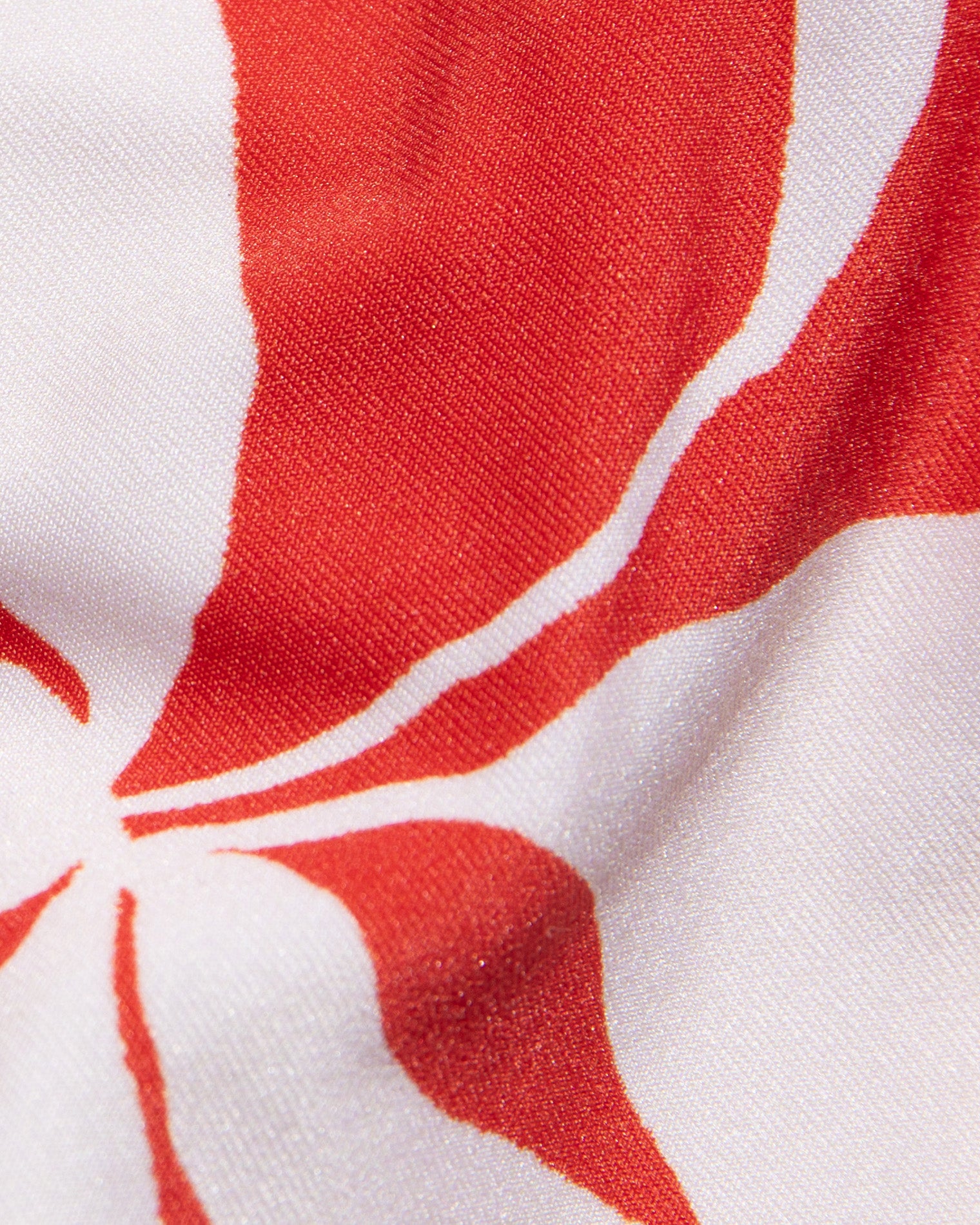 Mako Bikini Top - Hibiscus Bloom Close-up of red and white fabric pattern
