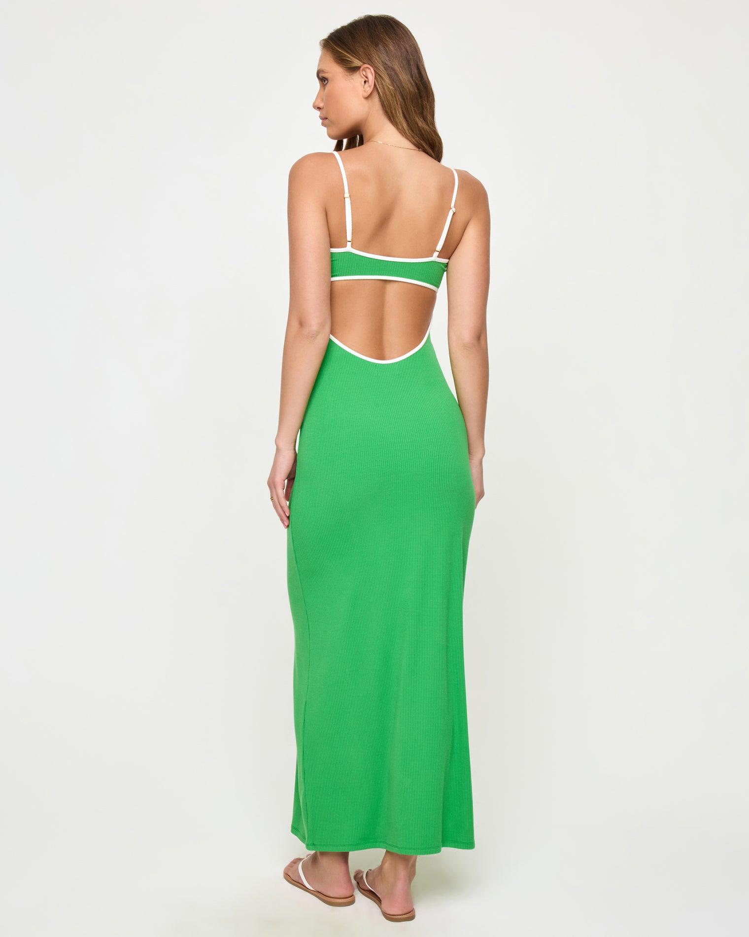 Jordana Dress - Clover-Cream Back view of a model wearing the LSPACE Jordana Dress in clover-cream, showing the open back design with cream contrast trim framing the cutout.