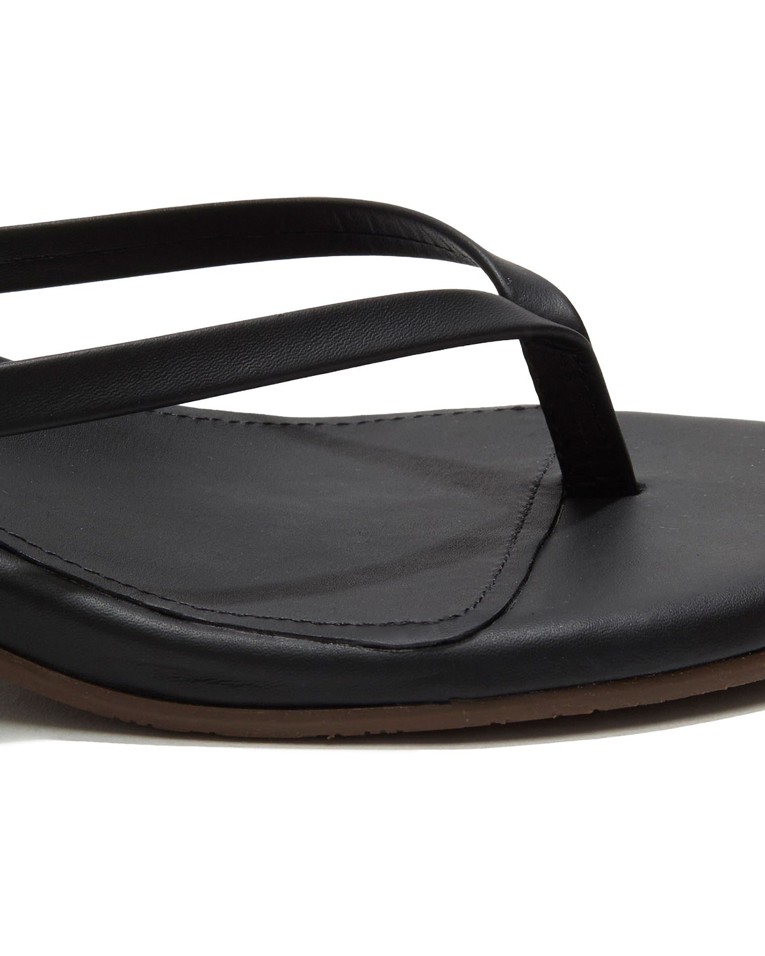 TKEES Julia Kitten Heel - Sable Close-up of the black sable leather thong strap and square-toe footbed on the TKEES Julia Kitten Heel.