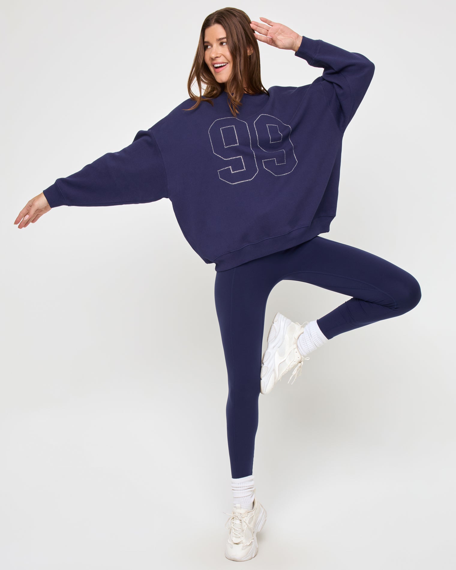 Legend Sweatshirt - Midnight Blue Side view of the LSPACE Legend Sweatshirt in midnight blue on a model against a light background, showing the cropped silhouette of the oversized sweatshirt.